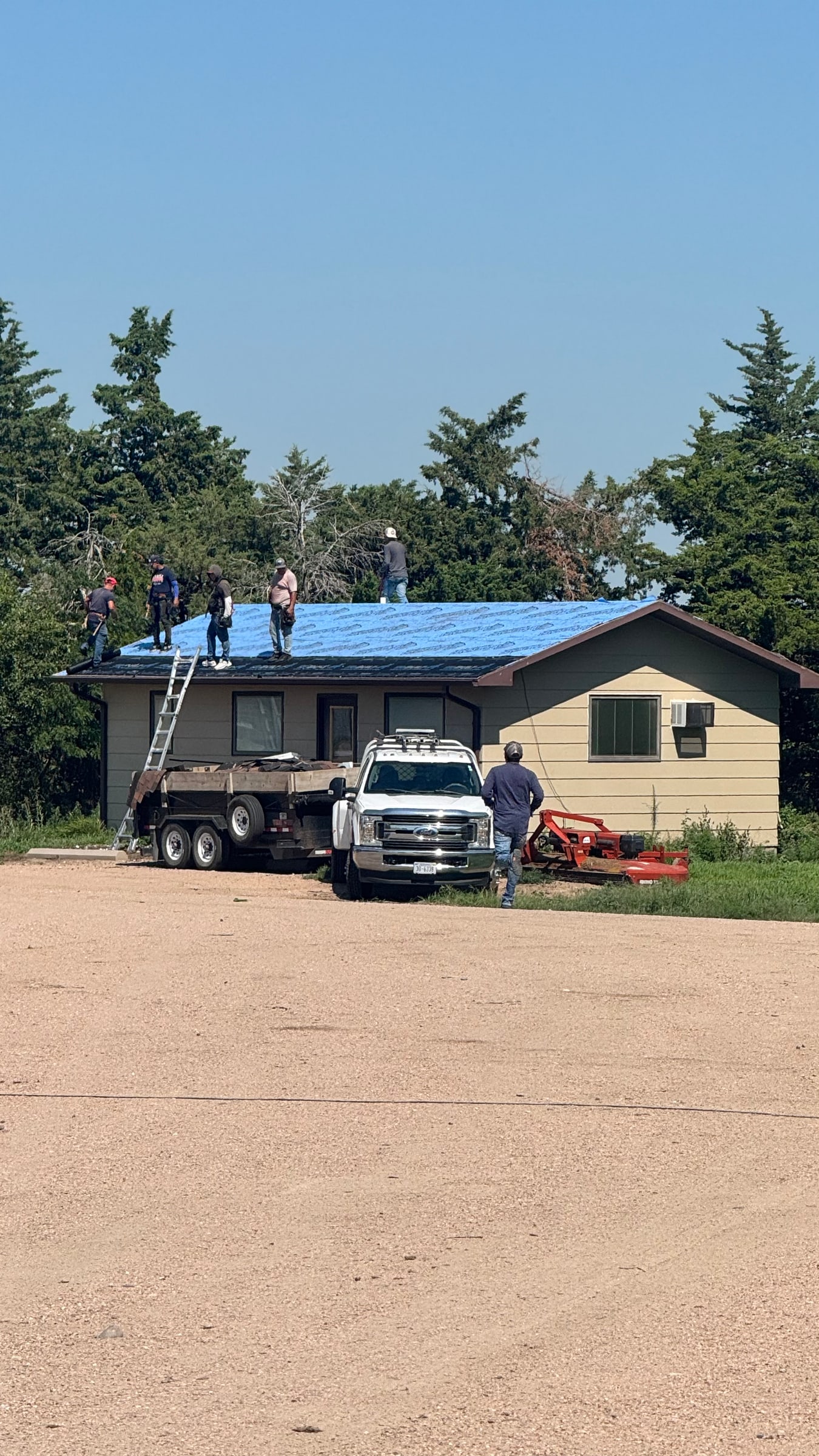 Roofing crew installing a residential roof