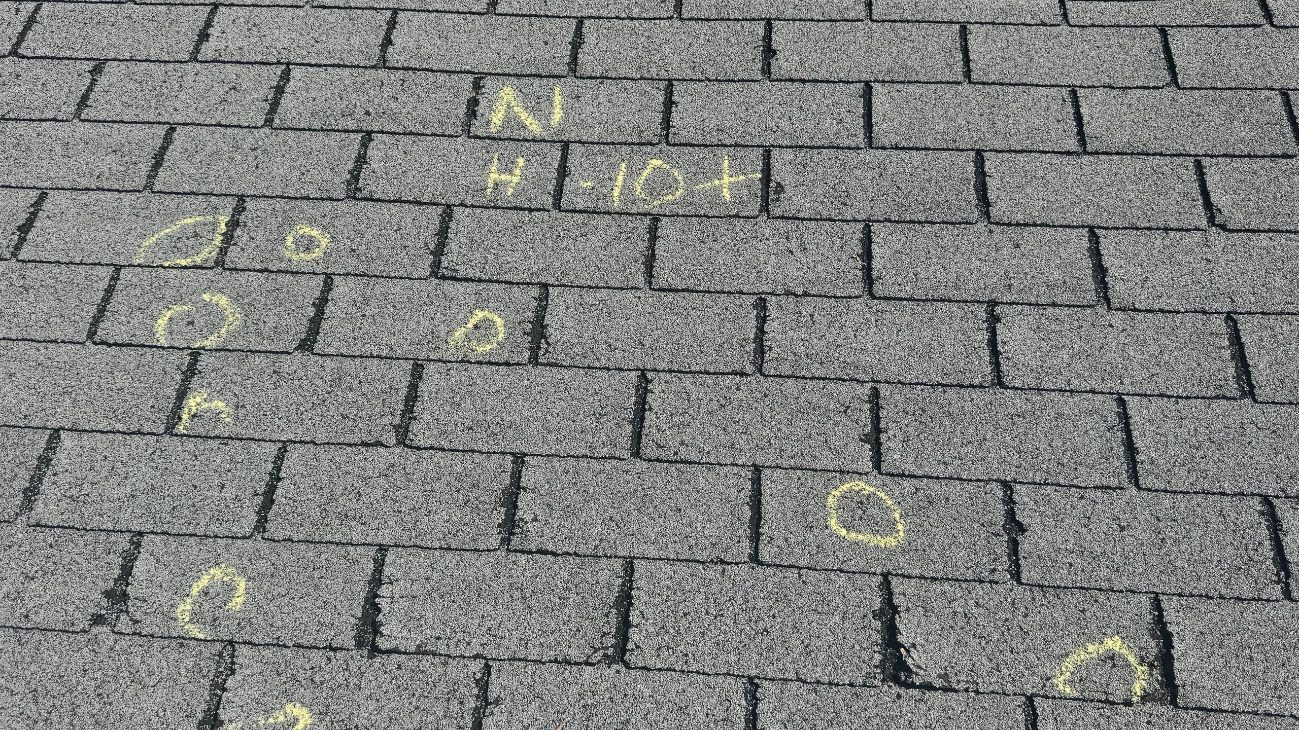 Close inspection of roof shingles