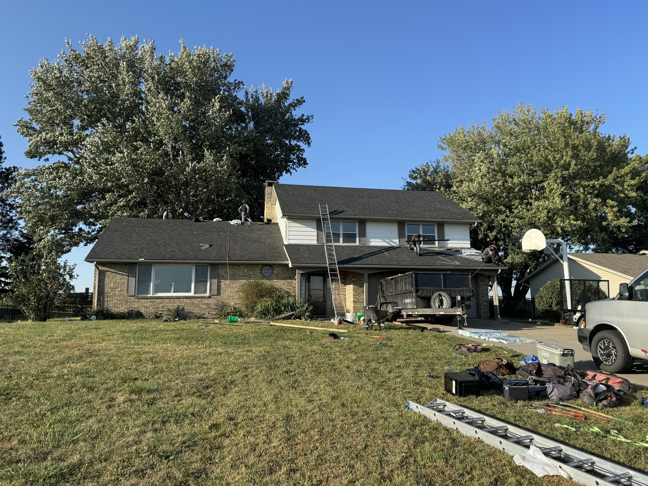 ROOF911 crew at work on a residential roof installation