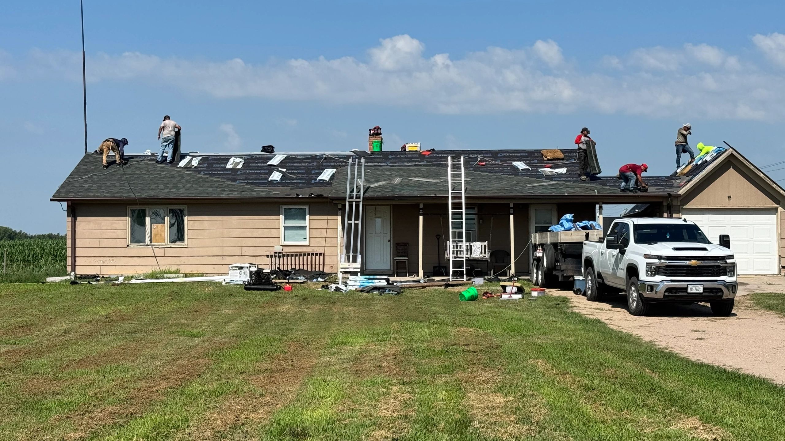 Crew installing IKO Dynasty shingles