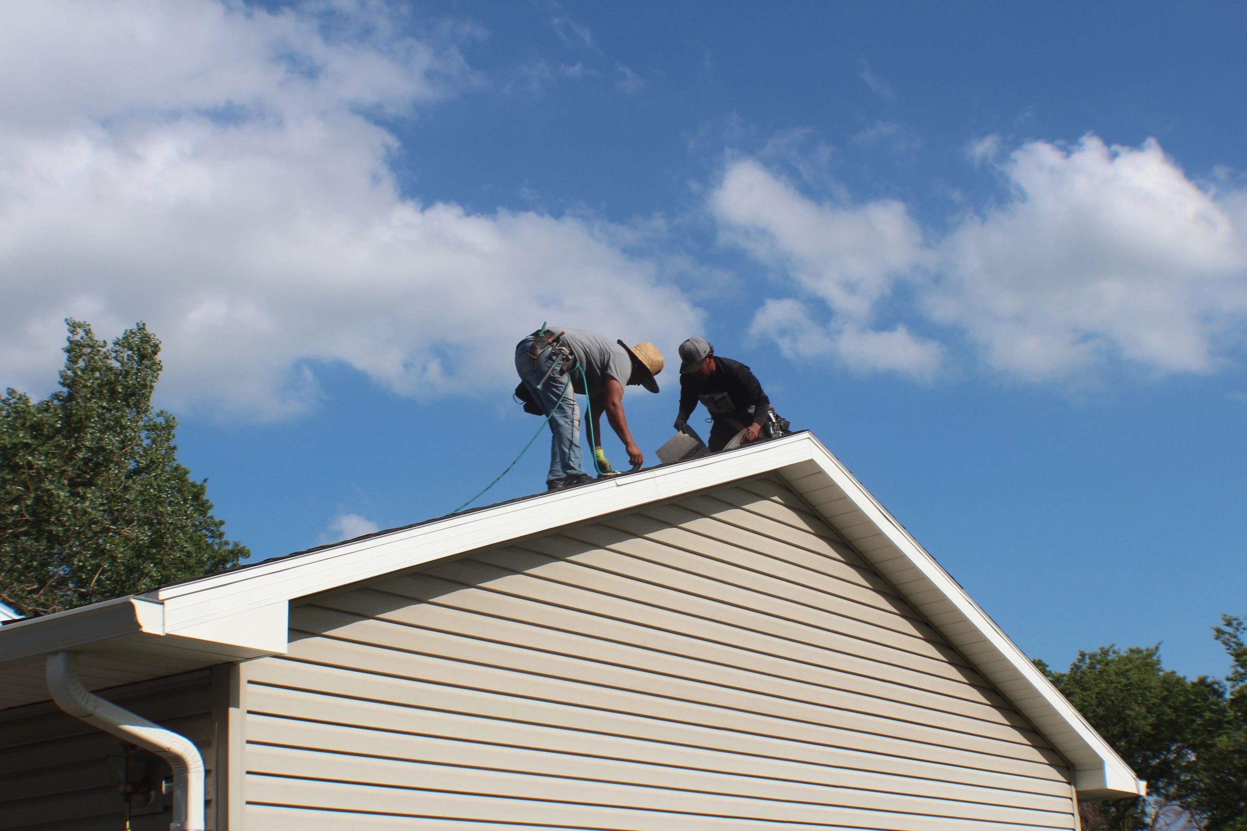 Roofers working on a home