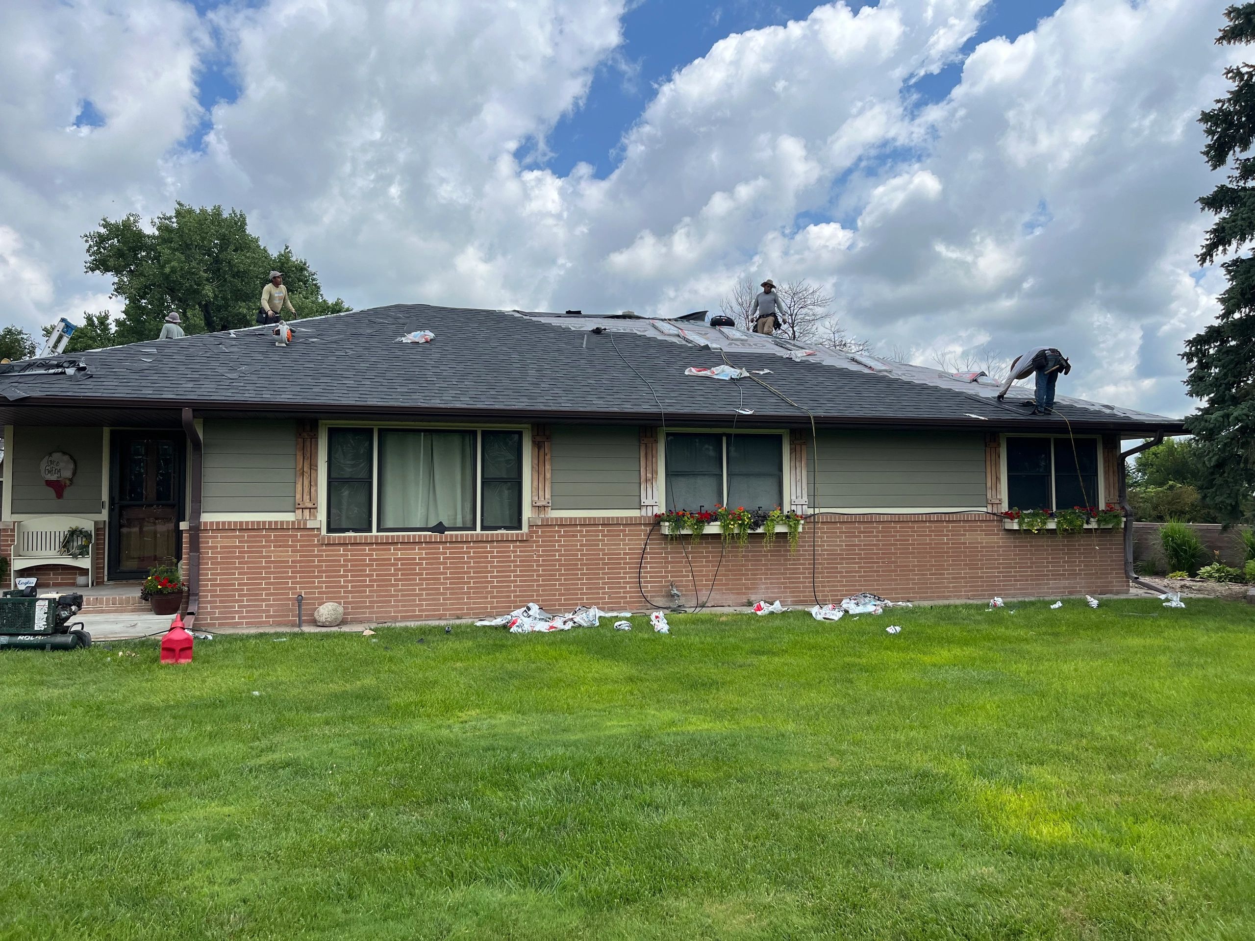 Dark shingle roof installation