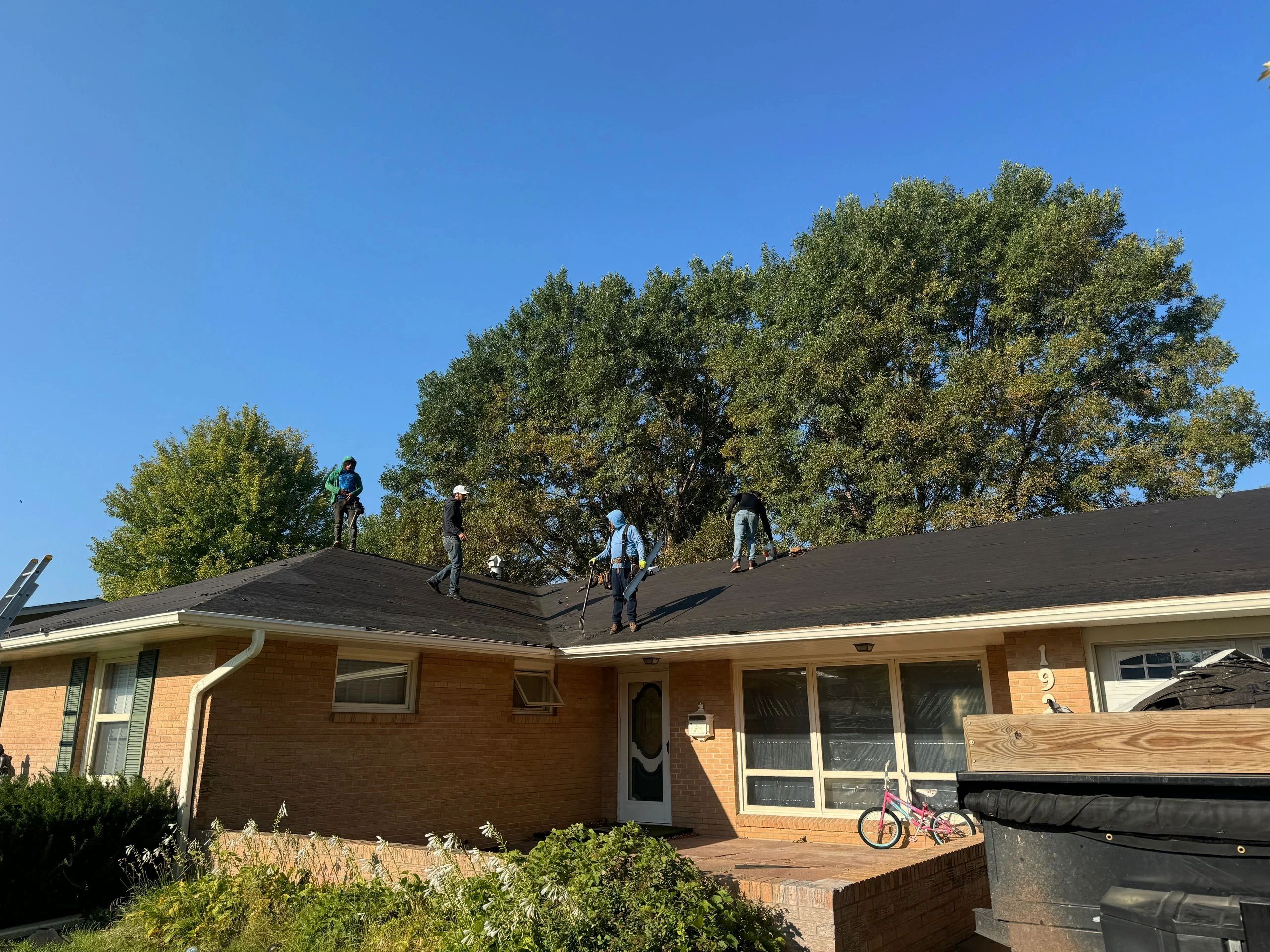 Roofing crew at work on a home