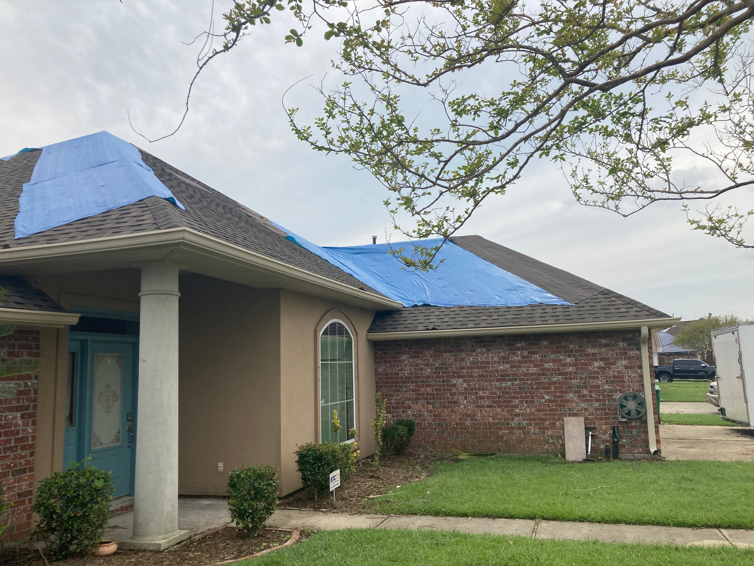 Residential roof protected during a roofing project