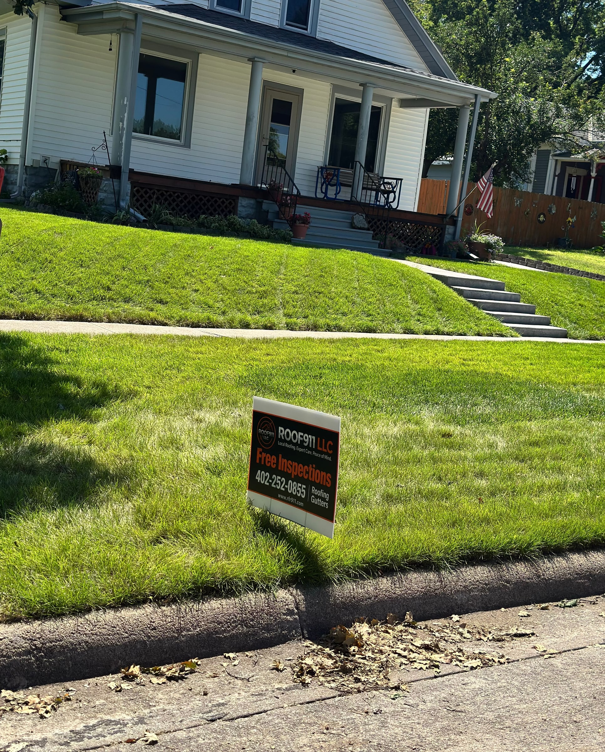 ROOF911 yard sign at a residential roofing project