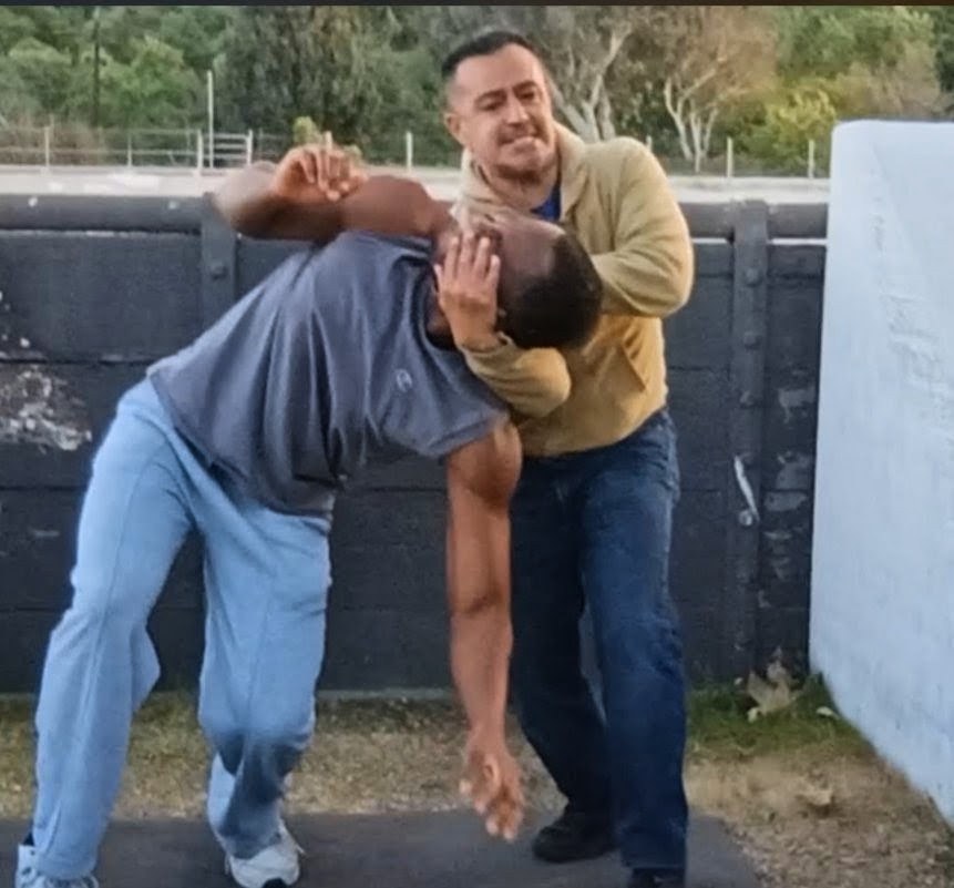 Vinny Cruz demonstrating self-defense outdoors