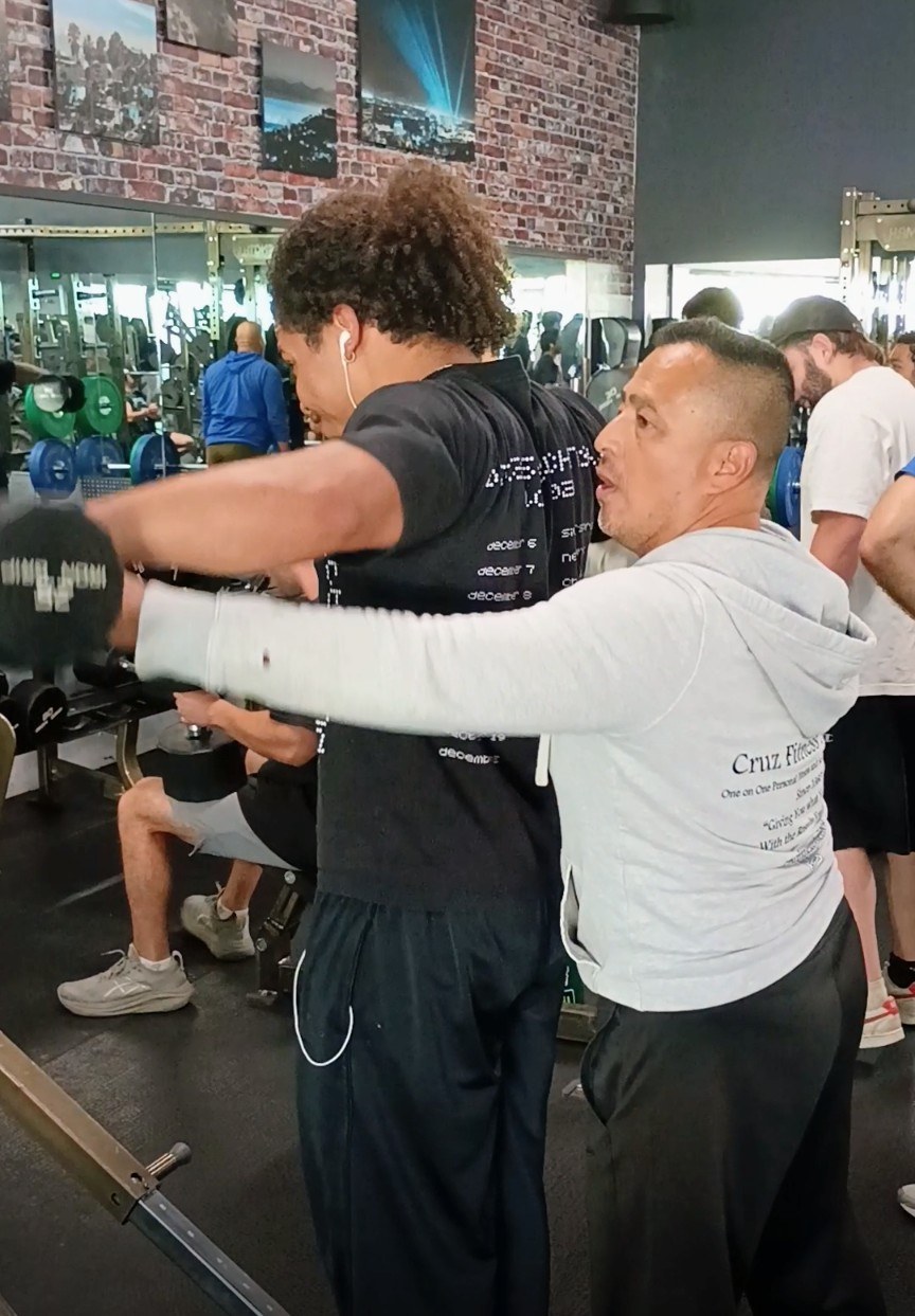 Coach guiding a strength session