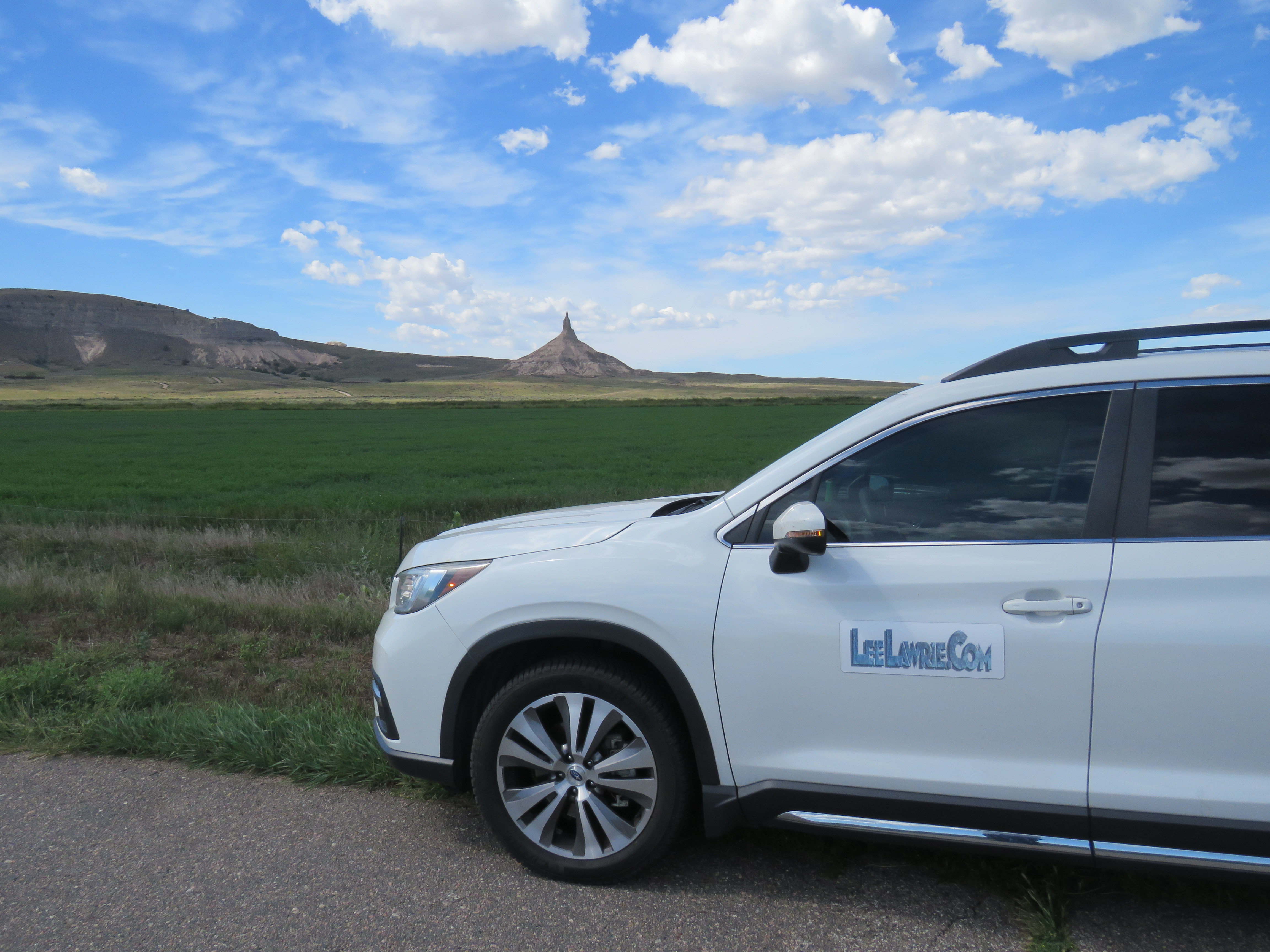 Chimney Rock rising above the prairie behind the Lee Lawrie Archive vehicle