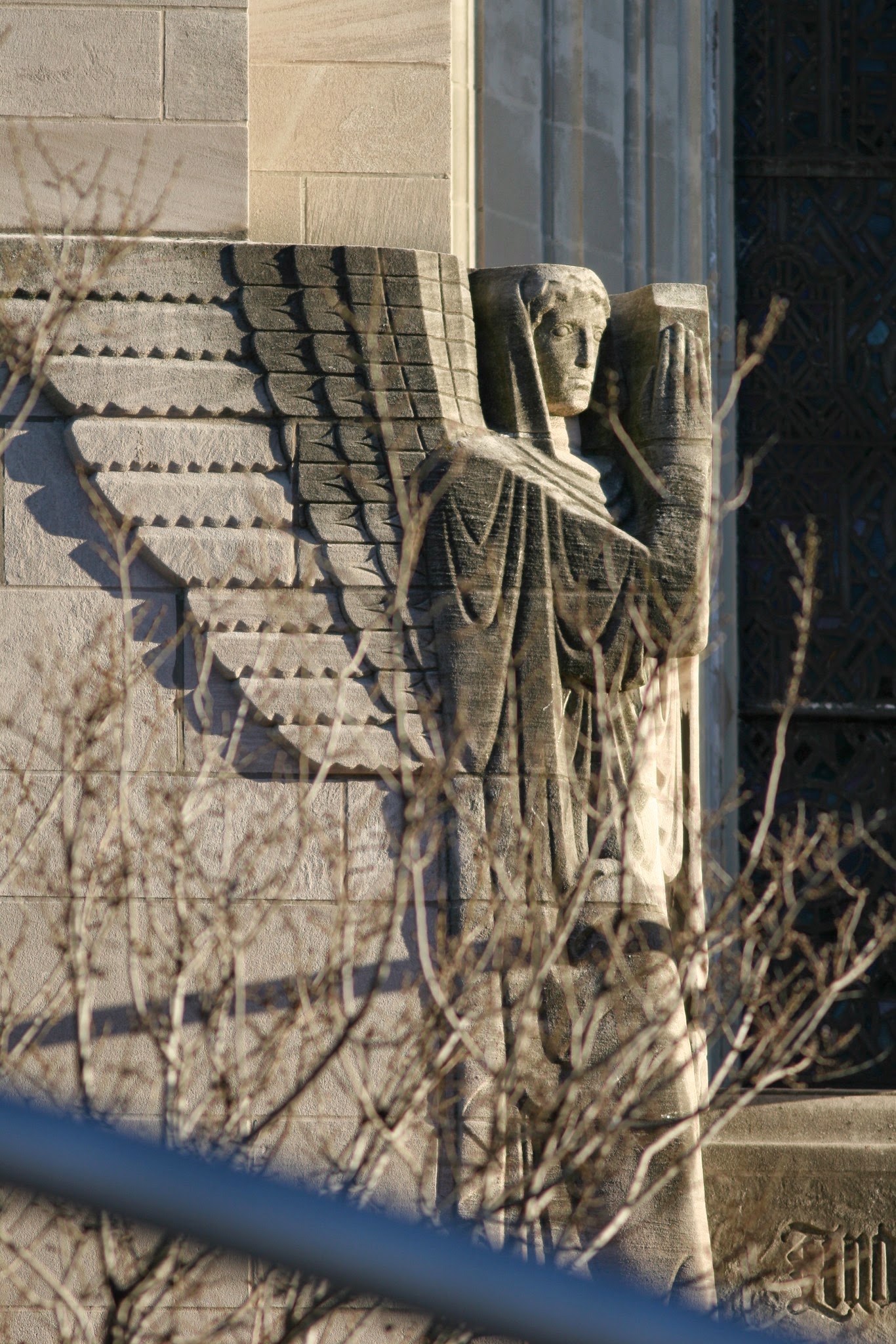 Exterior figure beside a church roofline