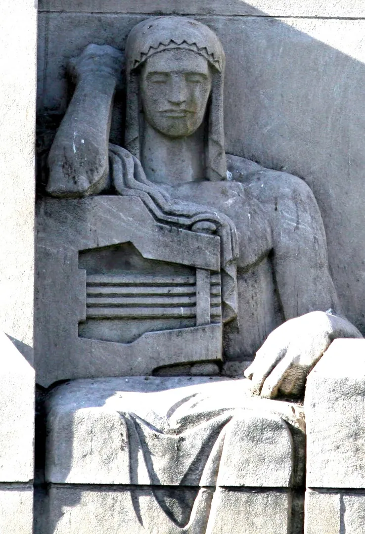 Photograph of The Poet, Close view of the seated stone figure at the north entrance, holding a lyre. An archival document identifies the figure as “Poesy,” meaning the art of writing poetry., from Lee Lawrie’s Los Angeles, California collection.