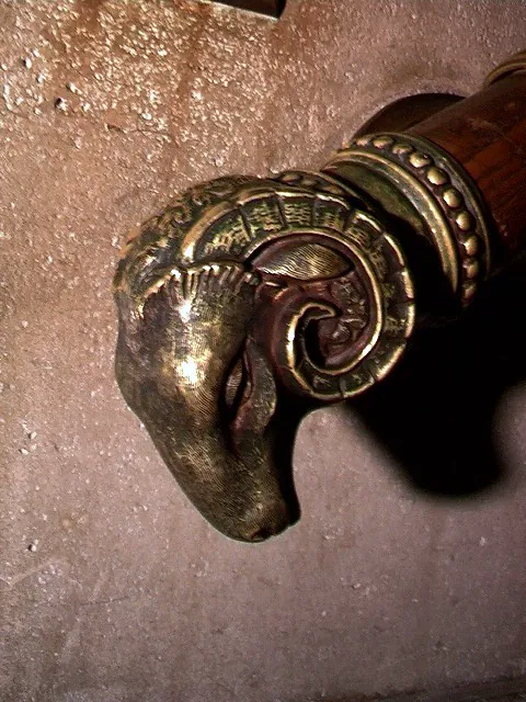 Bronze ram’s-head handrail finial, side view, Nebraska State Capitol · Lincoln, Nebraska