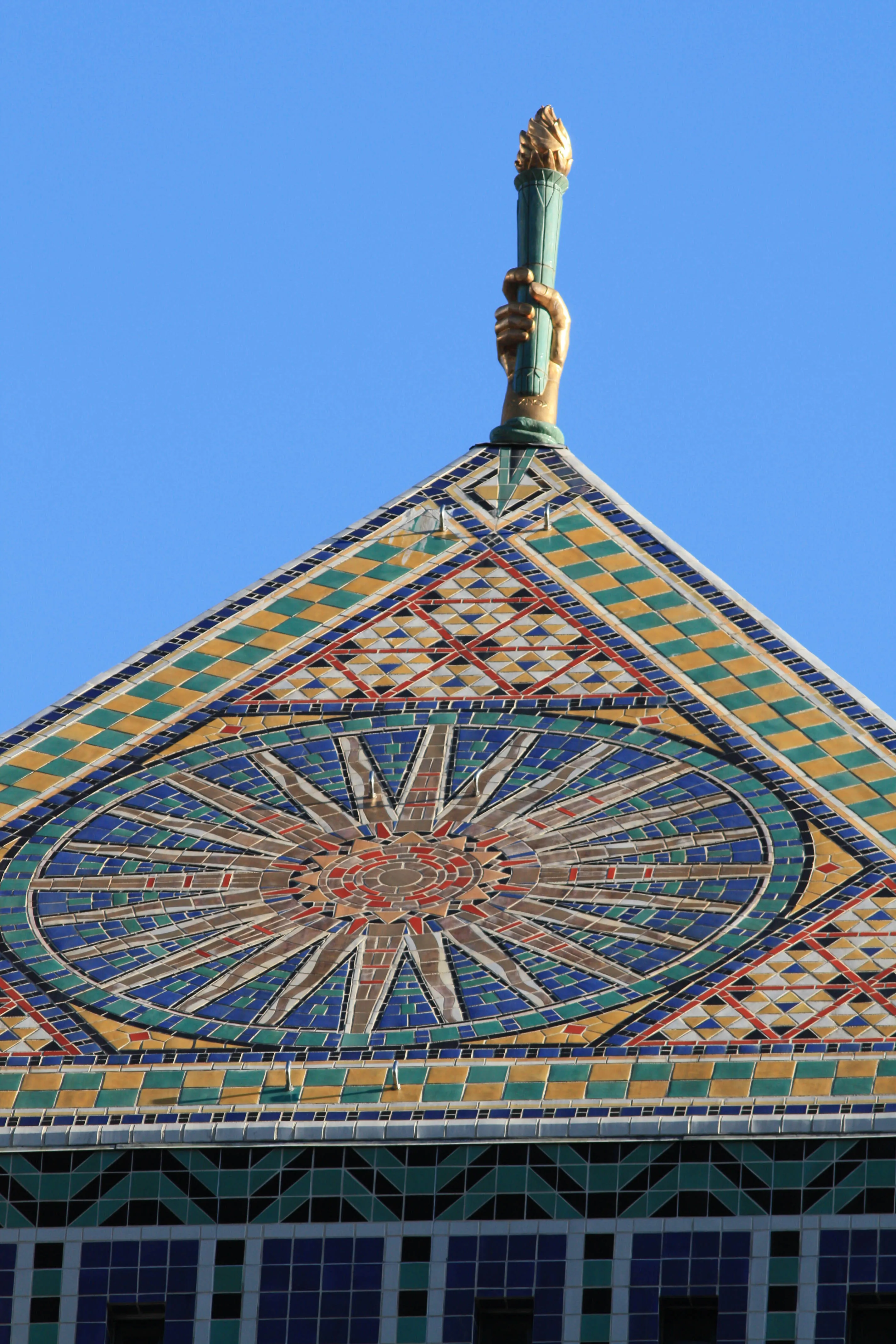 Photograph of The Torch of Knowledge. The Light of Learning, framed here as a monumental public symbol.