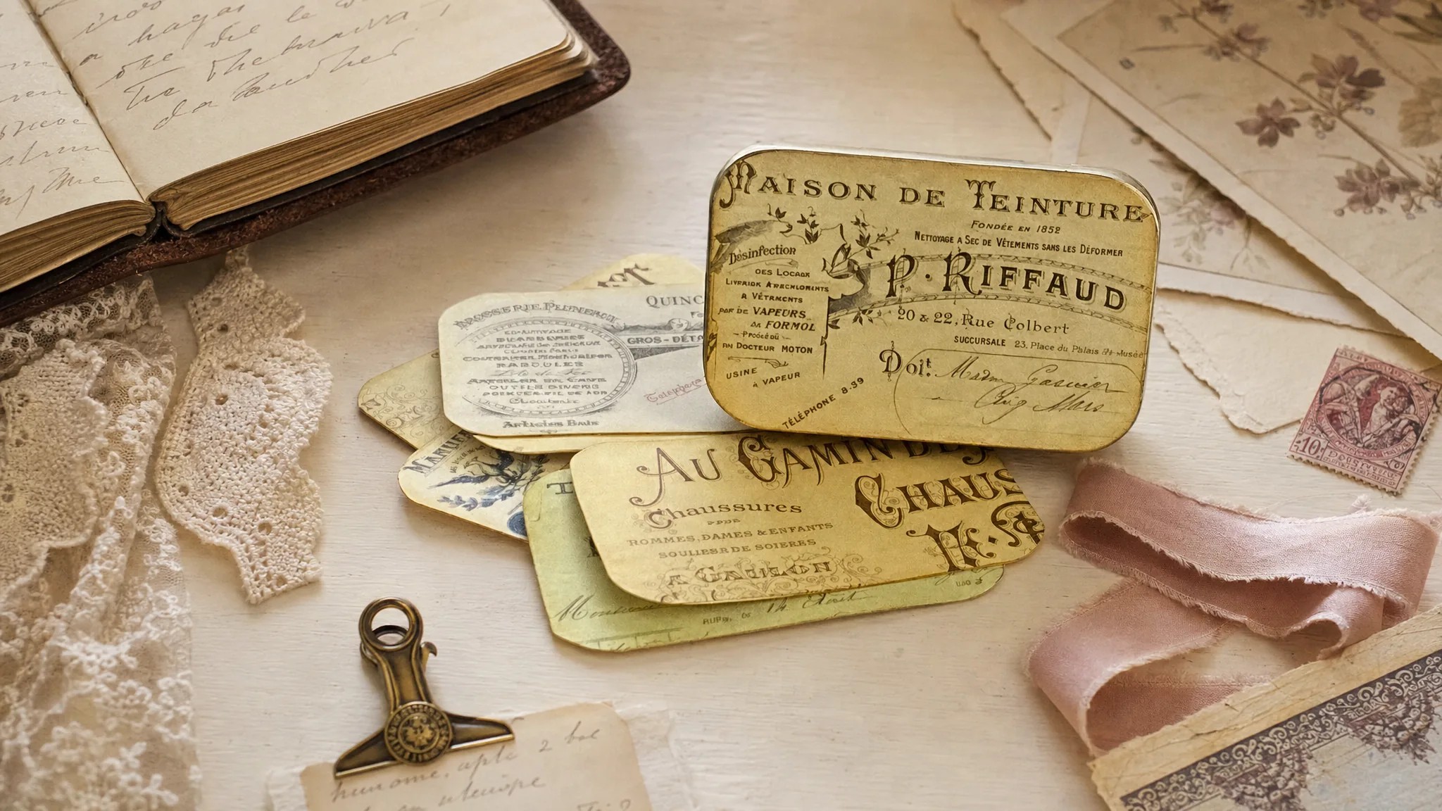 French Invoice Altoid tin labels arranged with lace, French paper, and rose ribbon