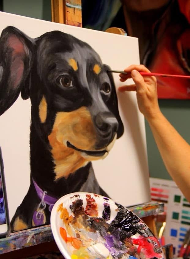 Michelle Johnson Fairchild painting a dog portrait
