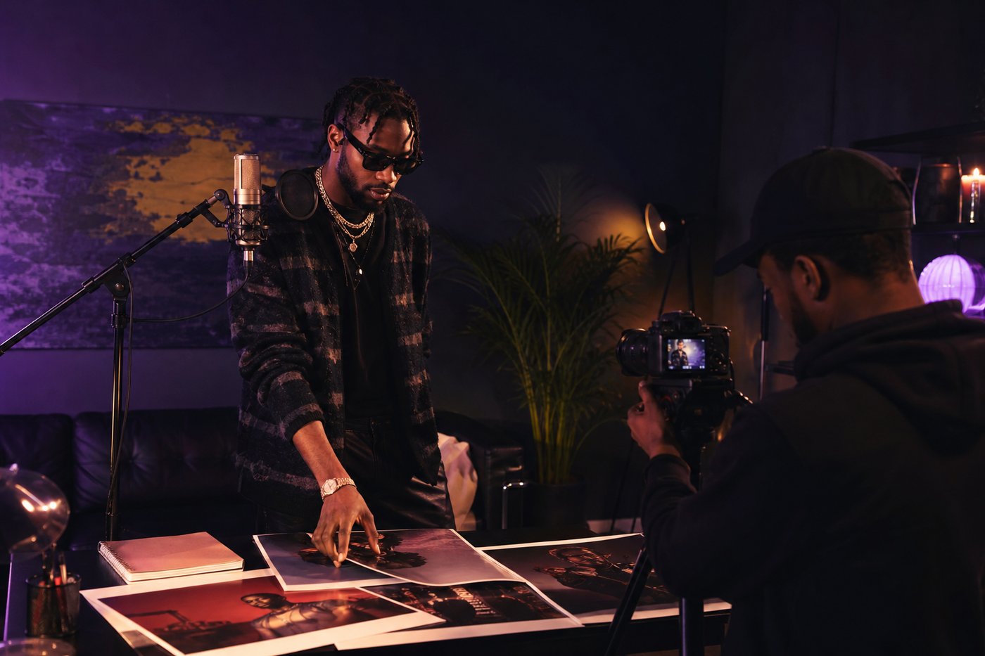 Recording artist working with a camera operator and microphone on a music campaign