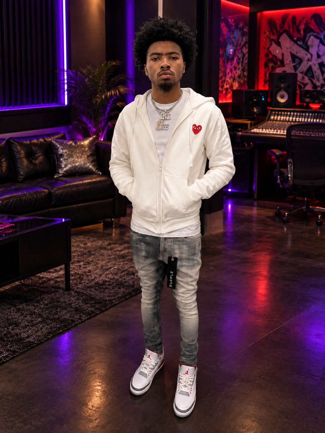 Lul Drako standing in a recording studio wearing a white jacket