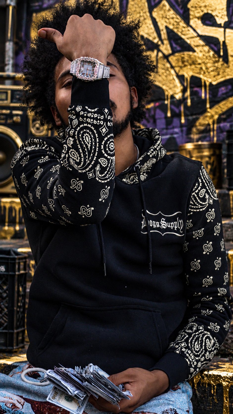 Close-up portrait of Lul Drako wearing a black patterned hoodie