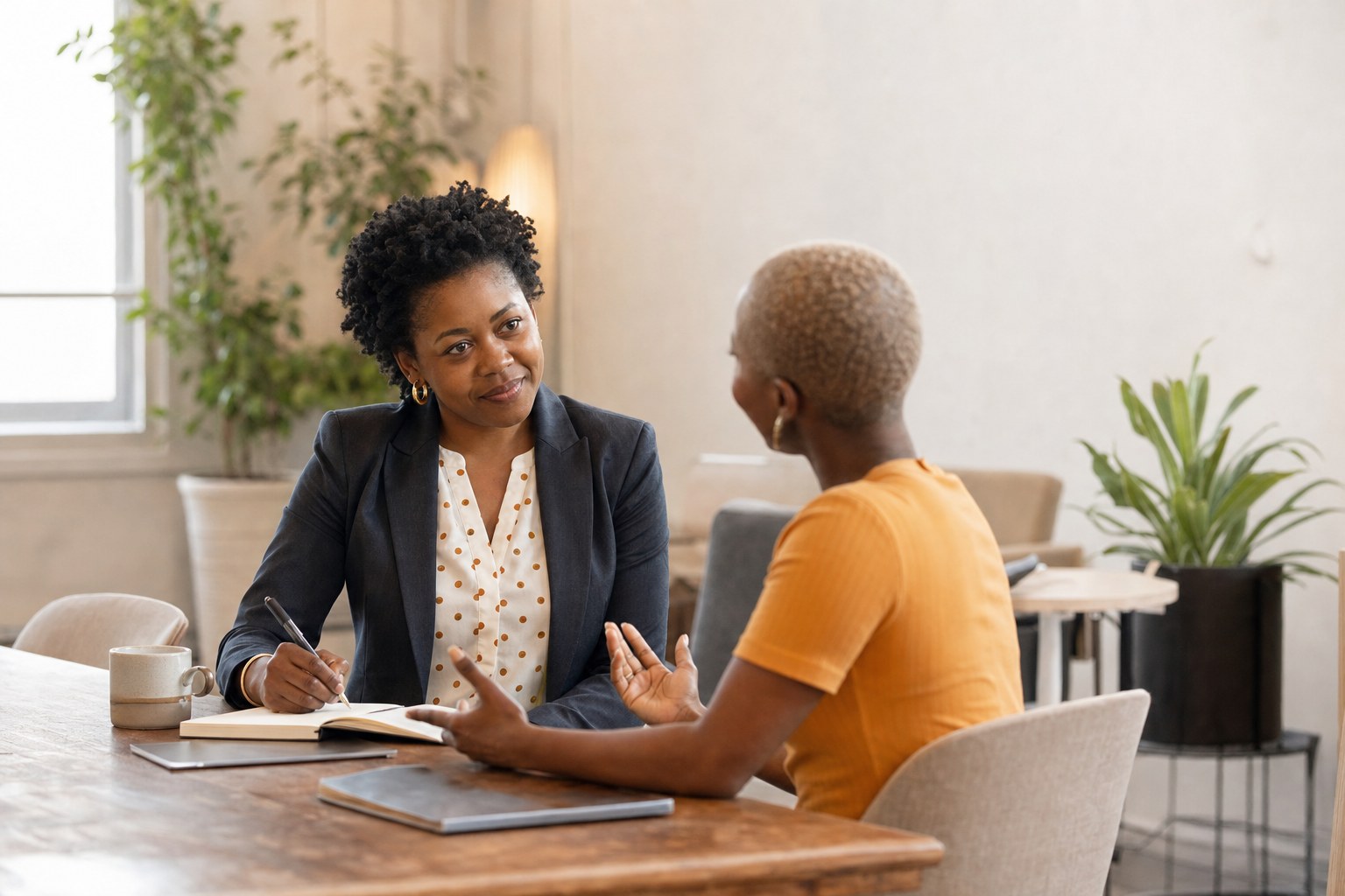 Advisor listening to a client at a table