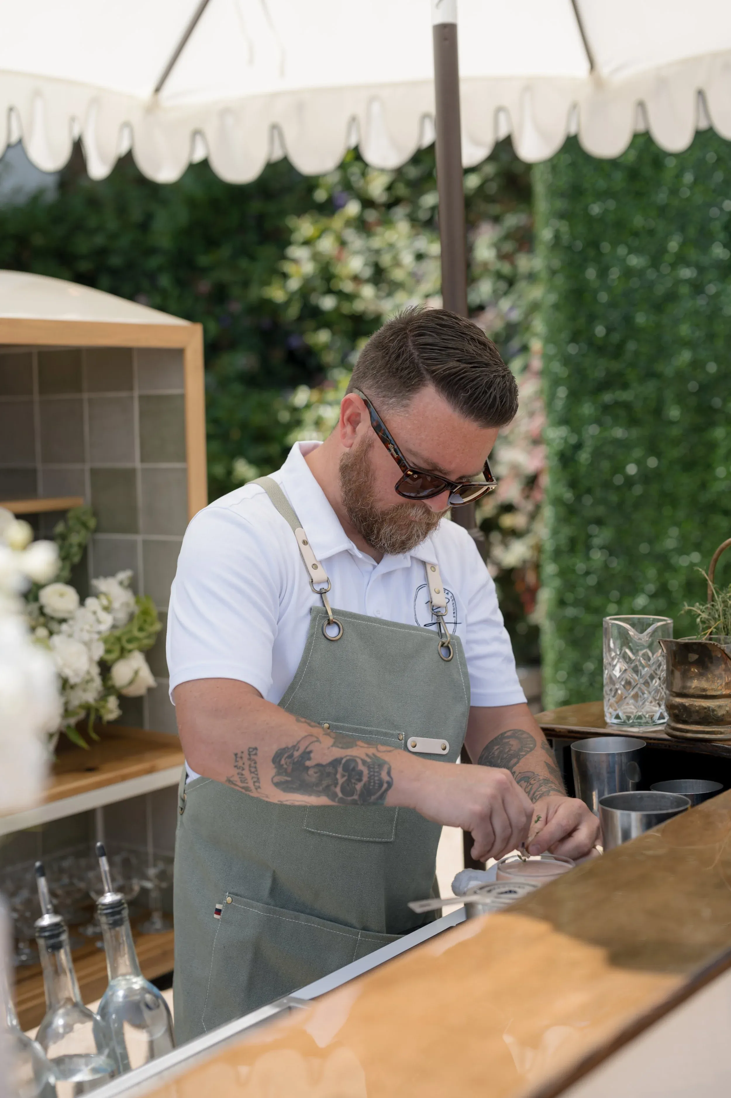 Bartender preparing drinks for a garden party