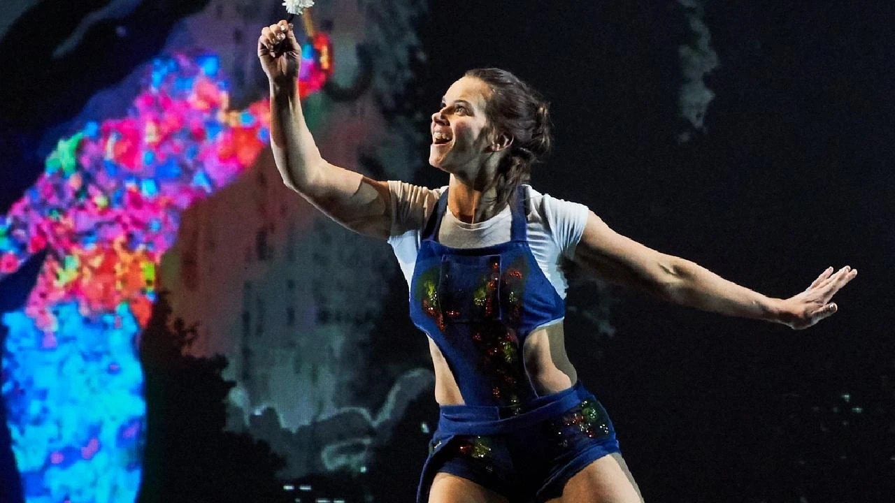 Kristy Sellars performing in blue costume