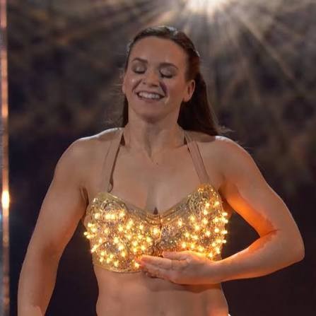 Kristy Sellars in a gold costume