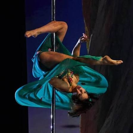 Kristy Sellars performing with turquoise fabric