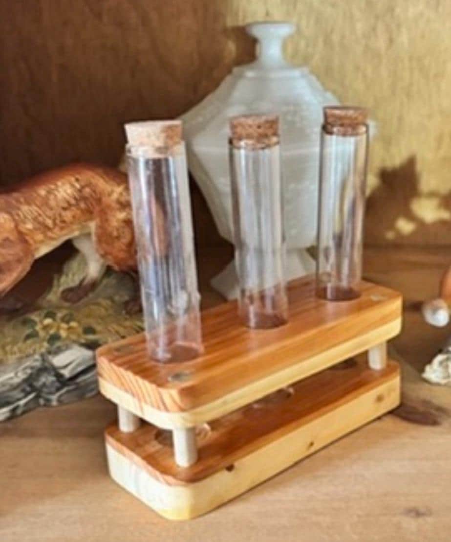 Detail of a handmade propagation stand with clear glass tubes