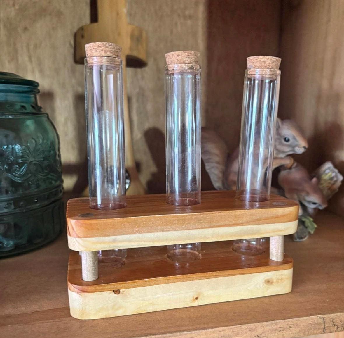 Handmade cedar and pine propagation stand with three glass tubes