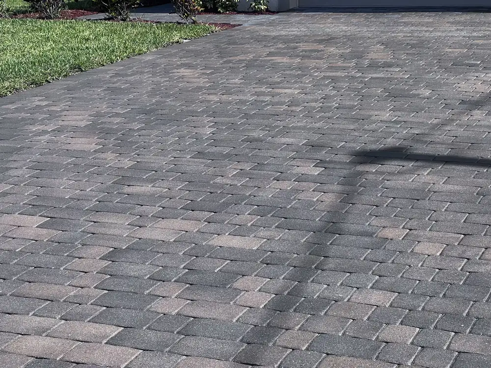 Cleaned and sealed gray-blend paver driveway with a natural, low-sheen finish in Cape Coral, FL
