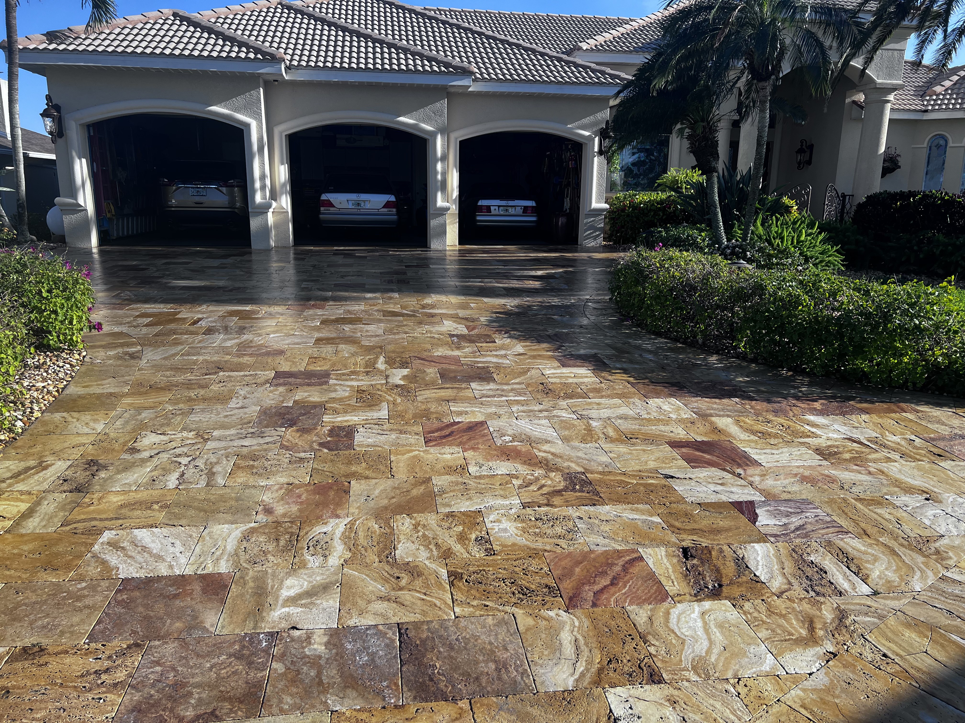 Travertine driveway and garage exterior in Southwest Florida