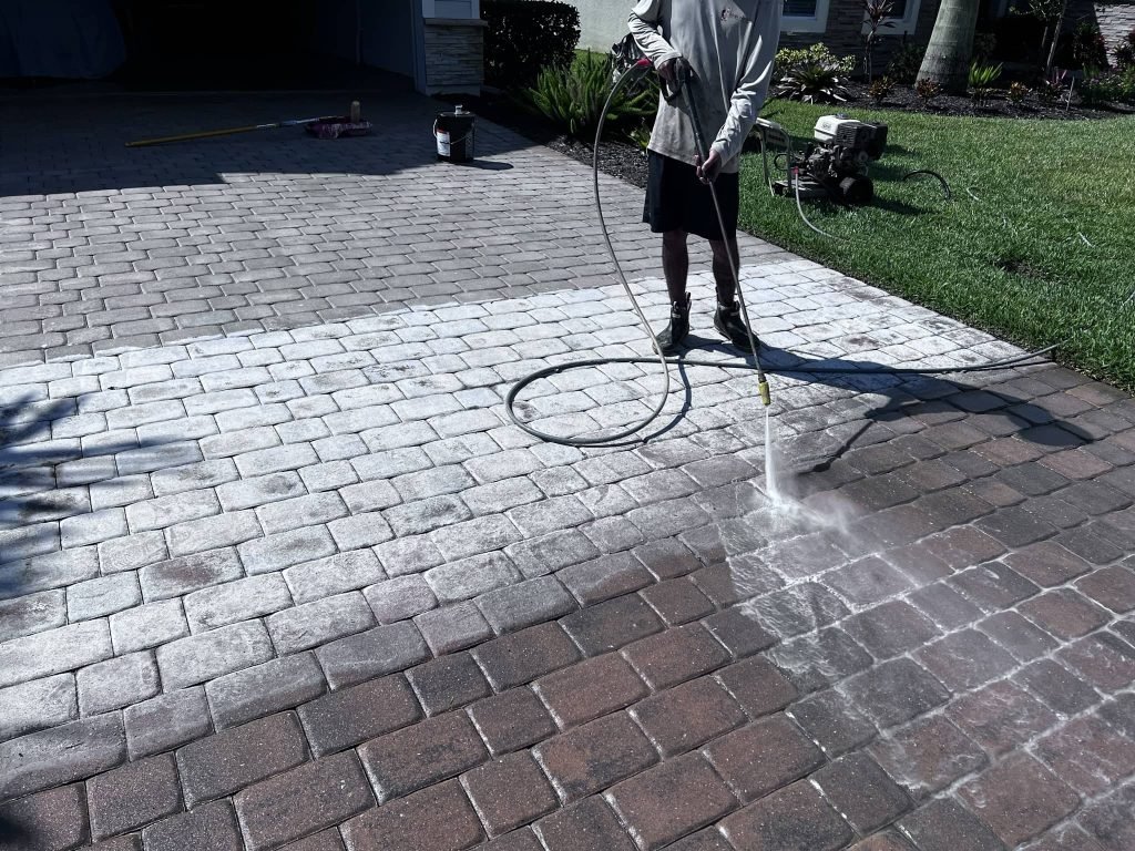 Pavers with failing sealer being restored