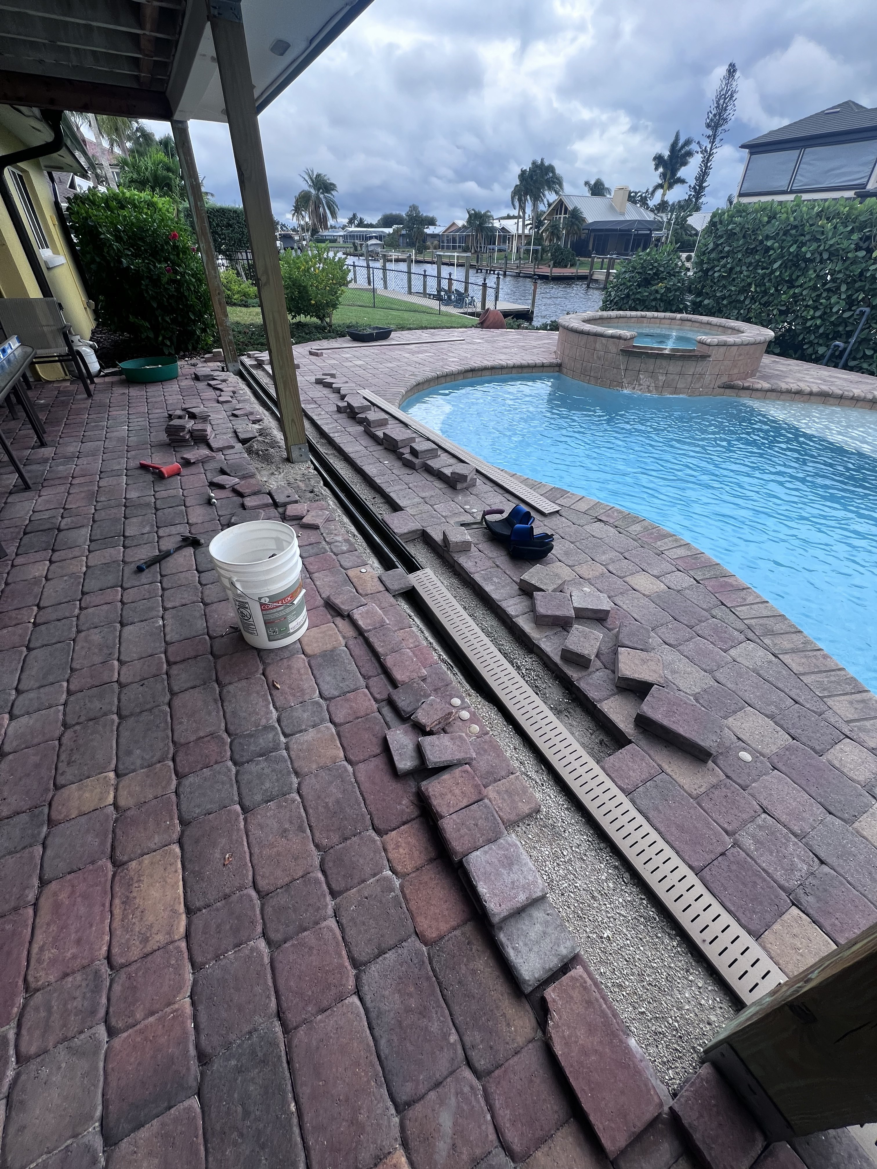 Channel drain installed alongside an outdoor paved area