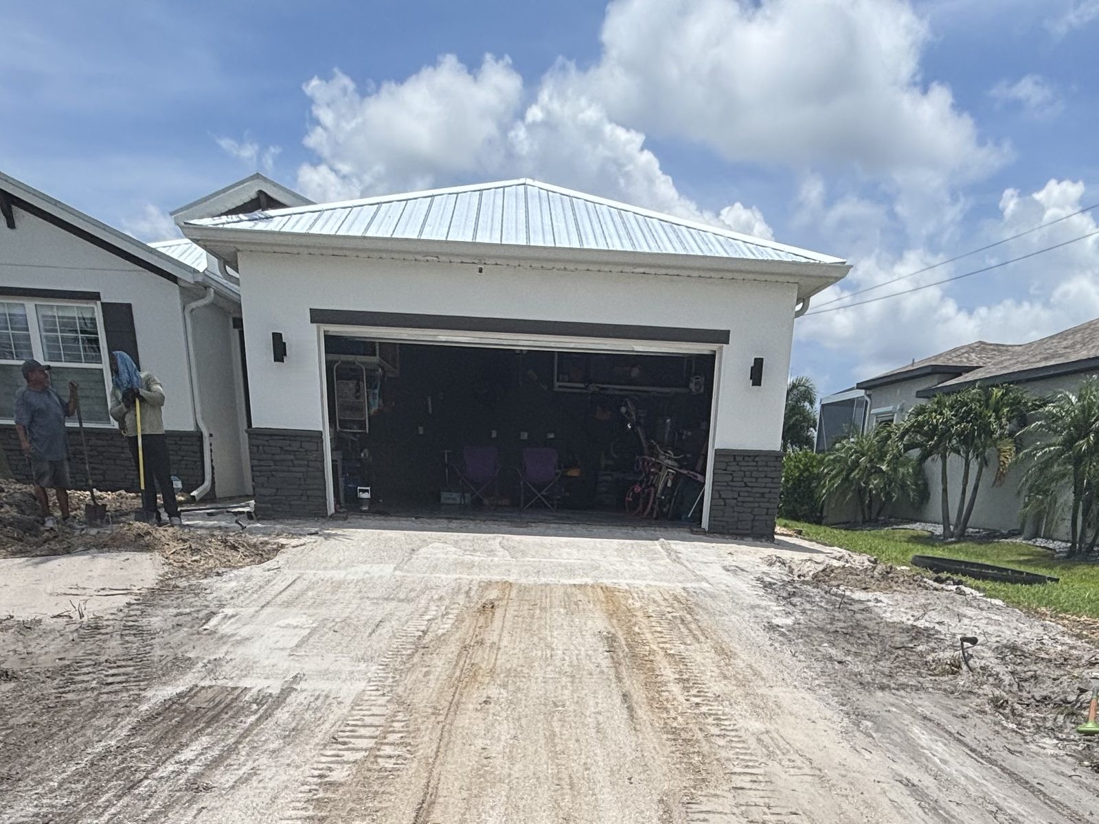 Driveway base being graded for a new paver installation in Cape Coral, FL