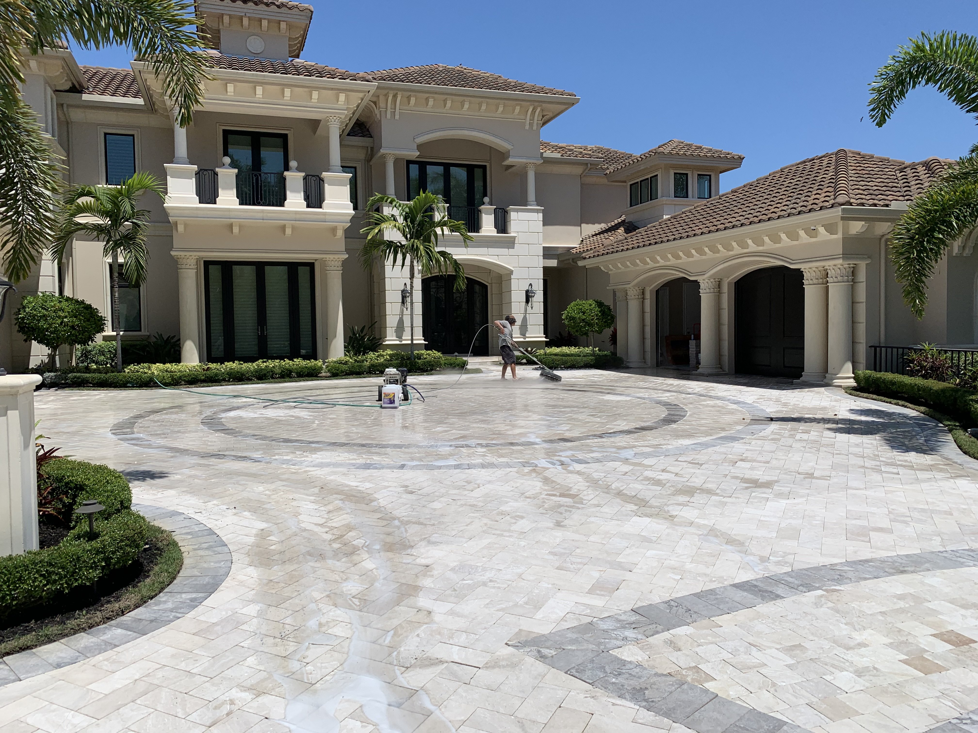 Natural travertine stone surface maintained around an outdoor living area