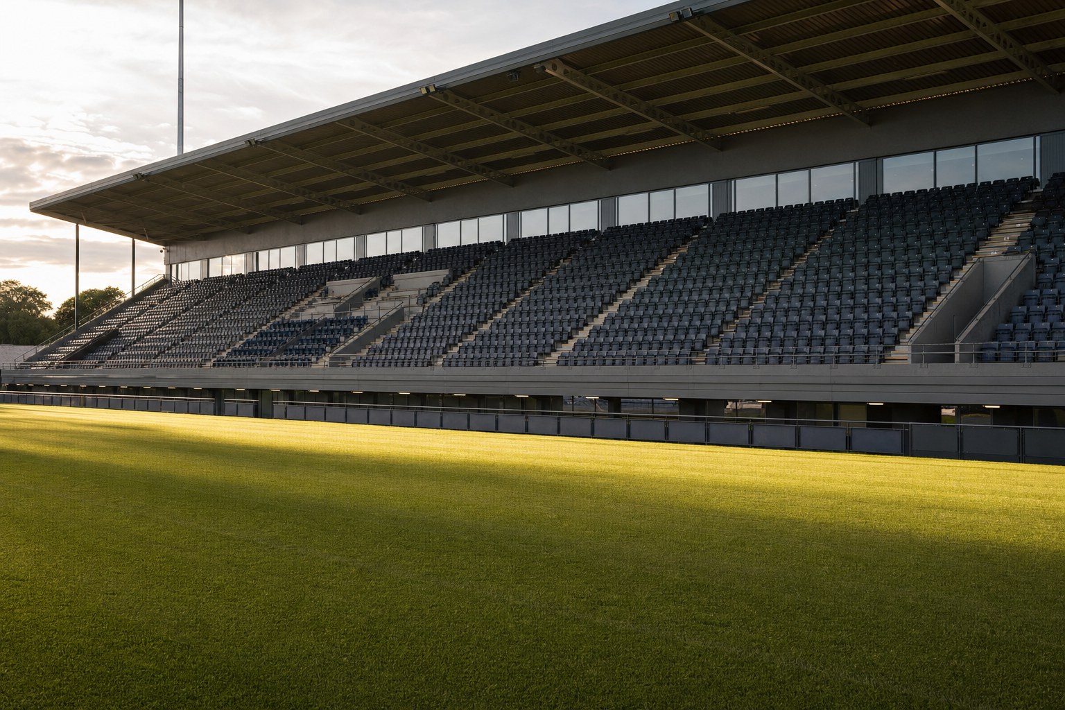 An empty football stand in late afternoon light