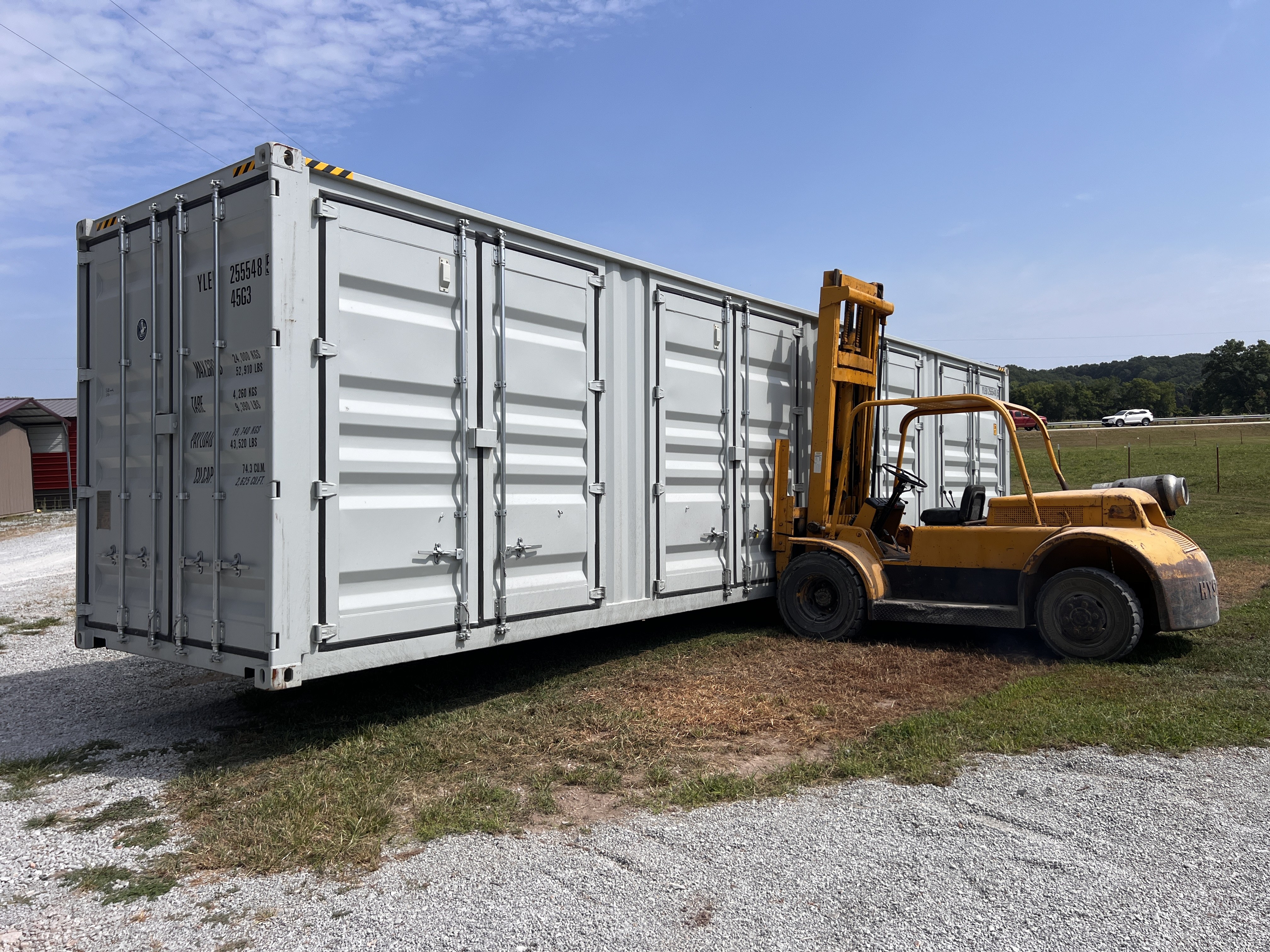 Shipping container with multiple side and end cargo doors