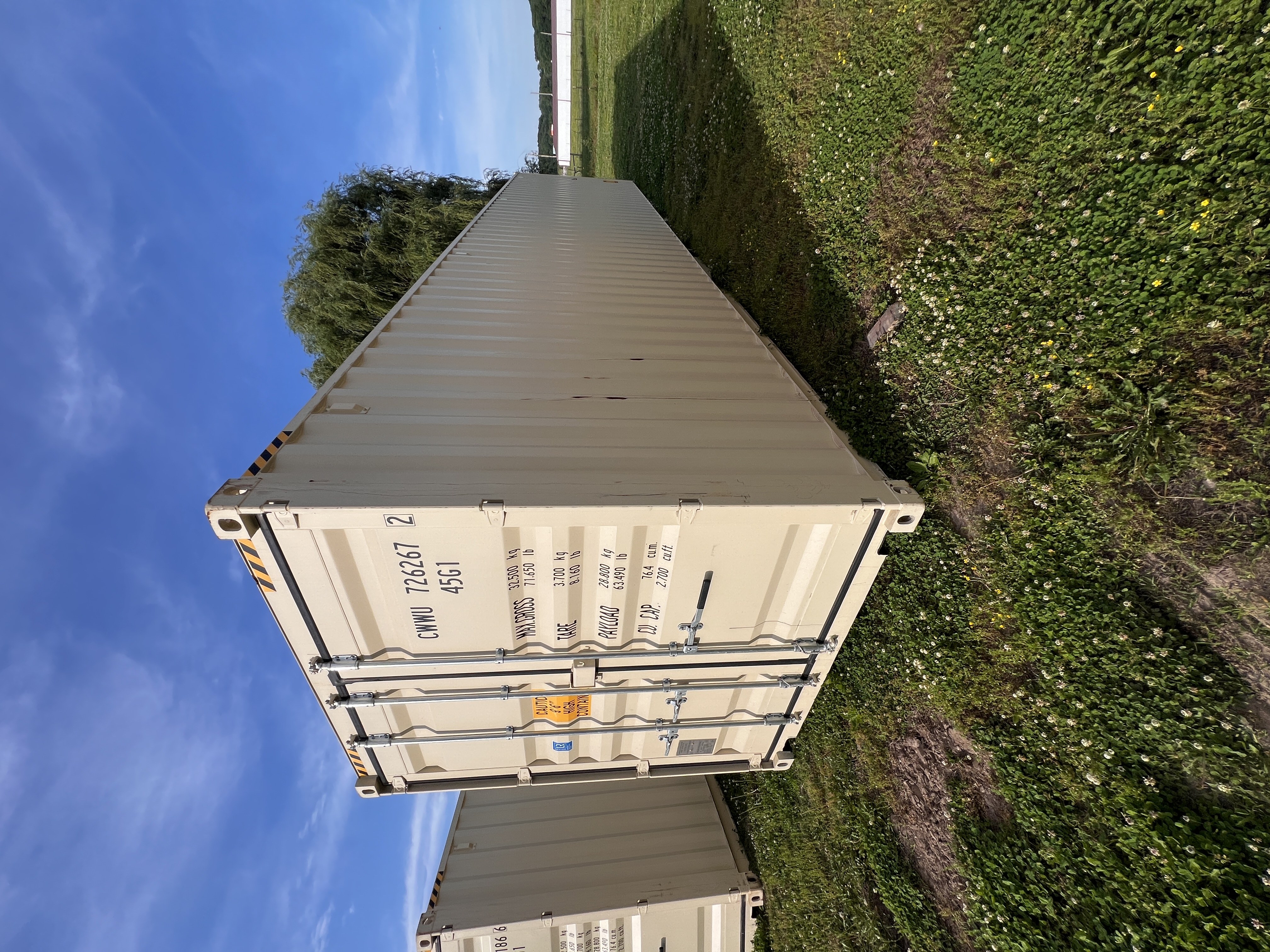 A shipping container with clear access along its side at Wood Tech Structures