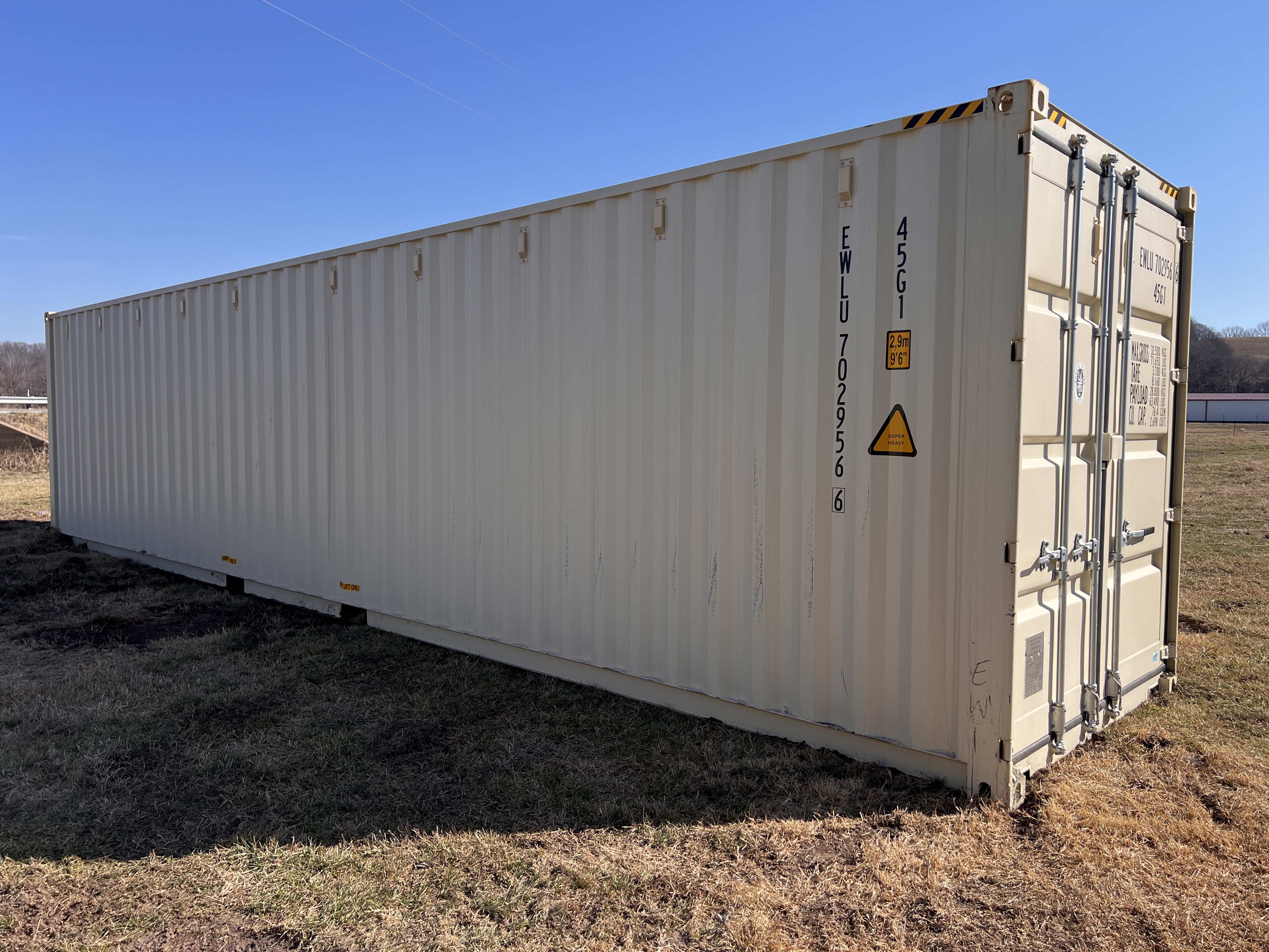 Side view of a 40-foot high-cube shipping container at Wood Tech Structures