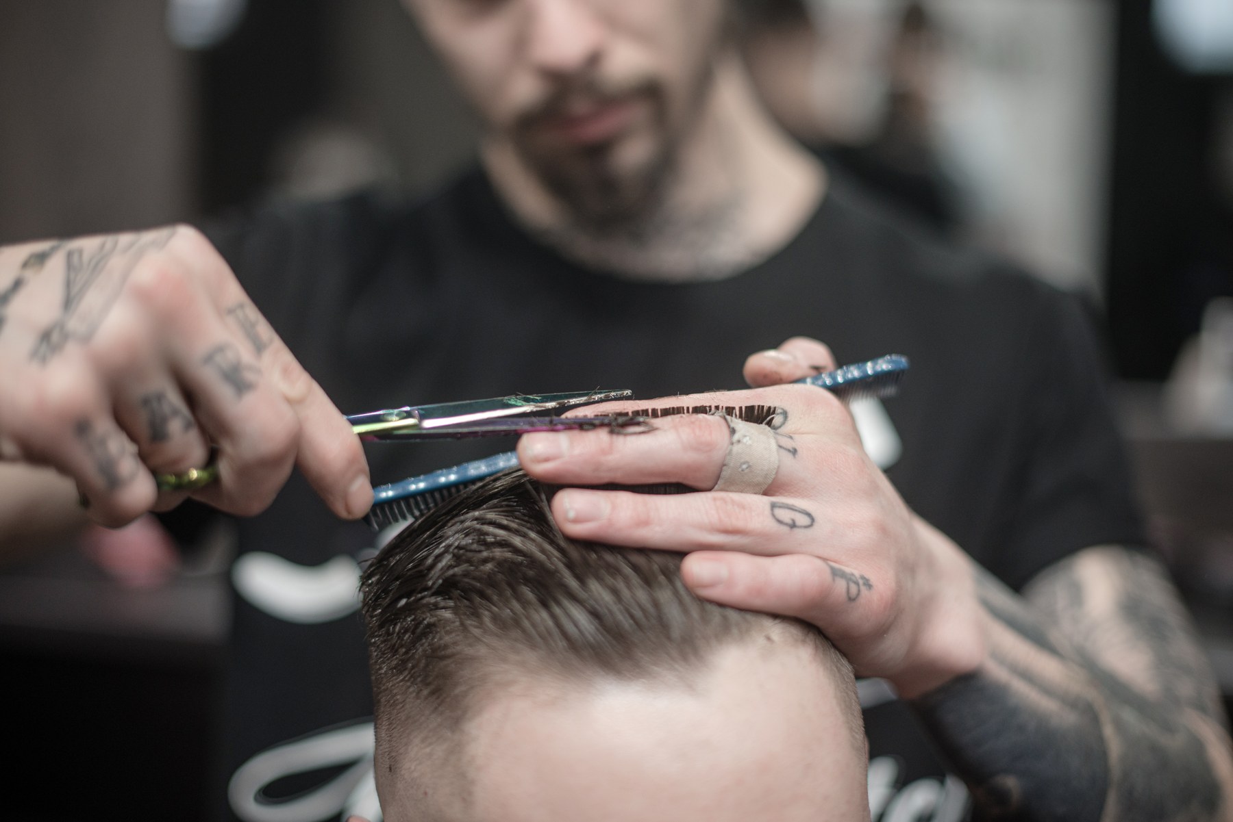 A barber at work during a grooming appointment