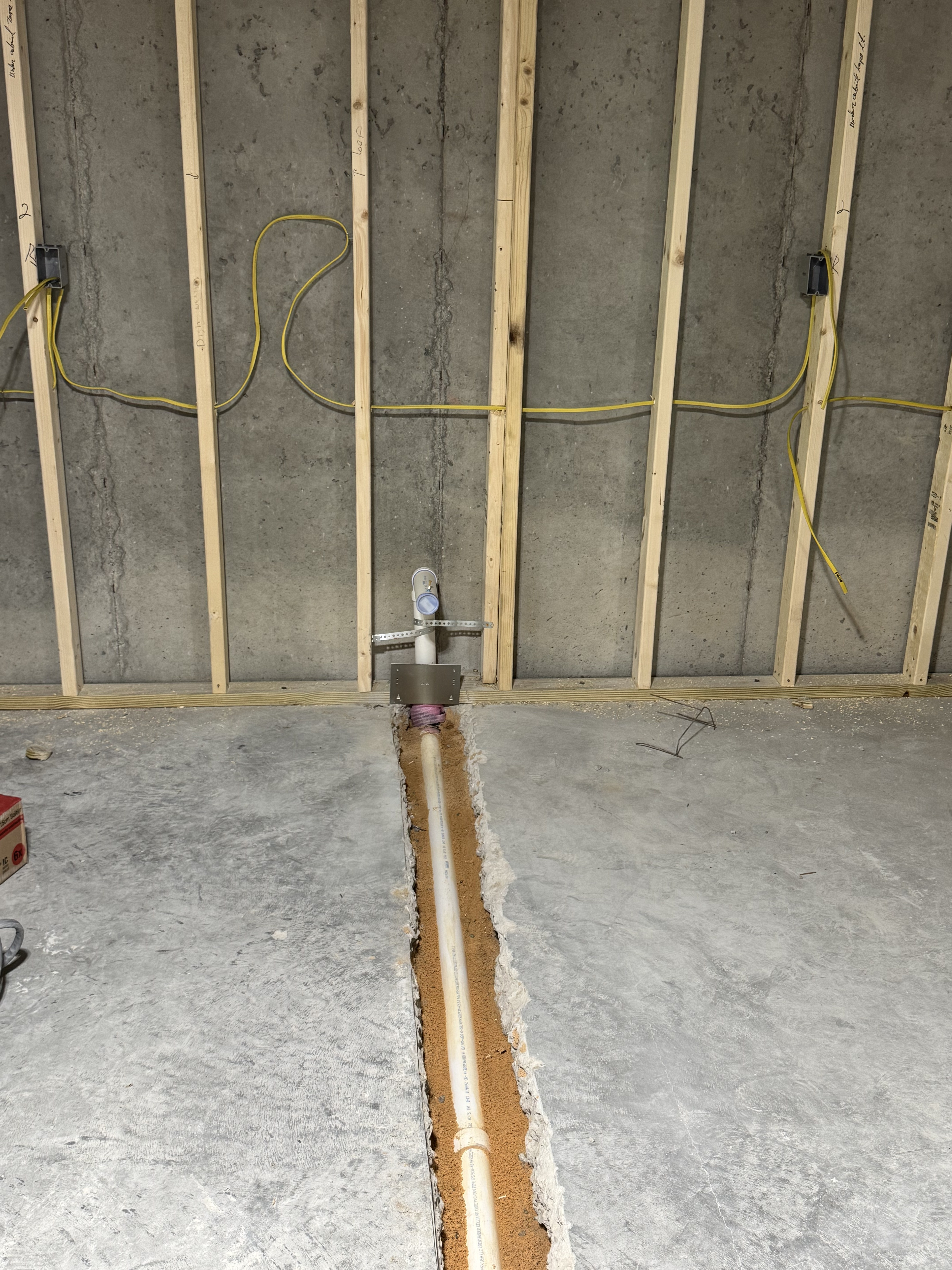 Basement plumbing rough-in progress for Hawthorne basement remodel in Apex, North Carolina