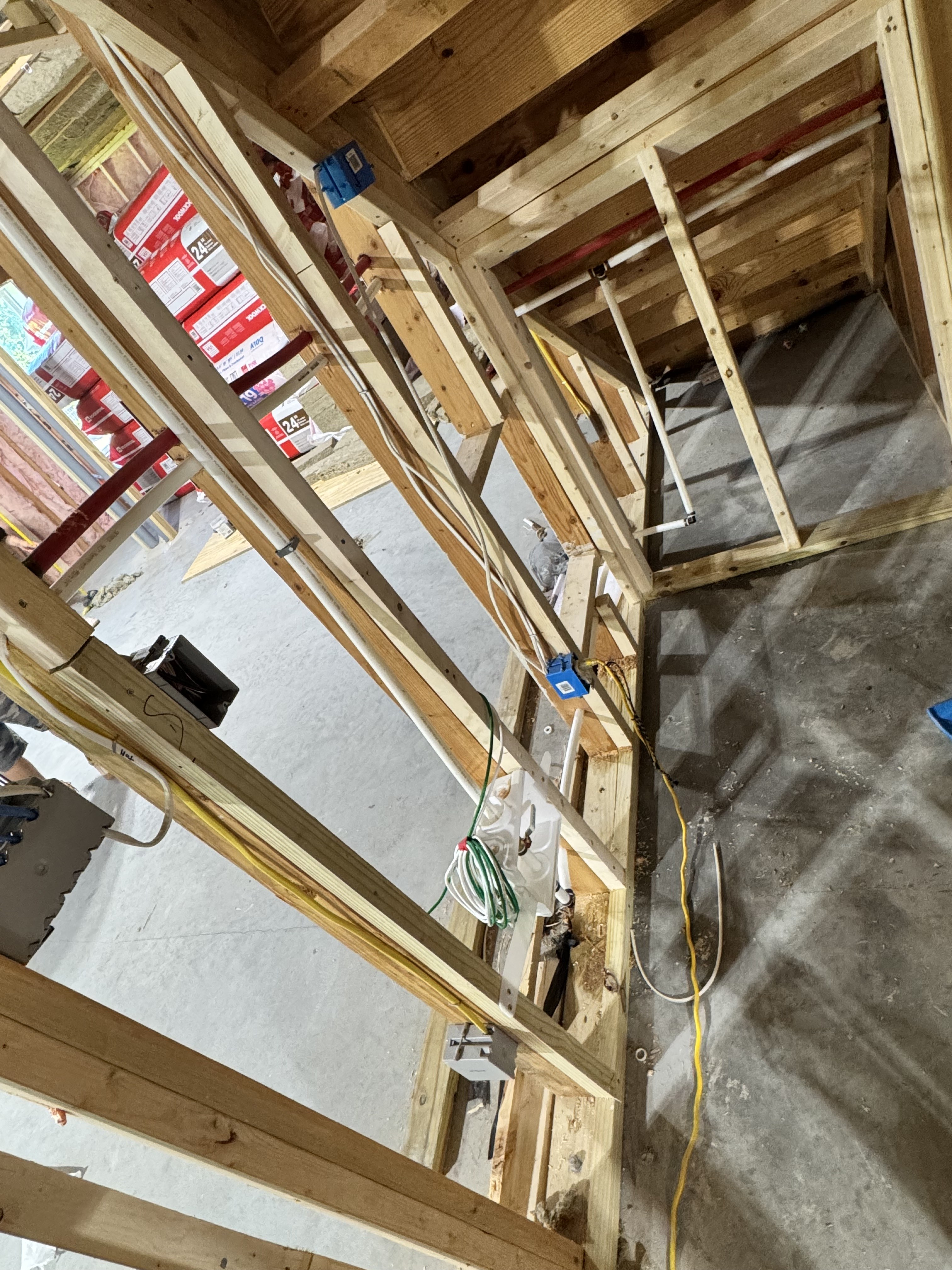 Basement electrical and framing progress for Urban Construction project