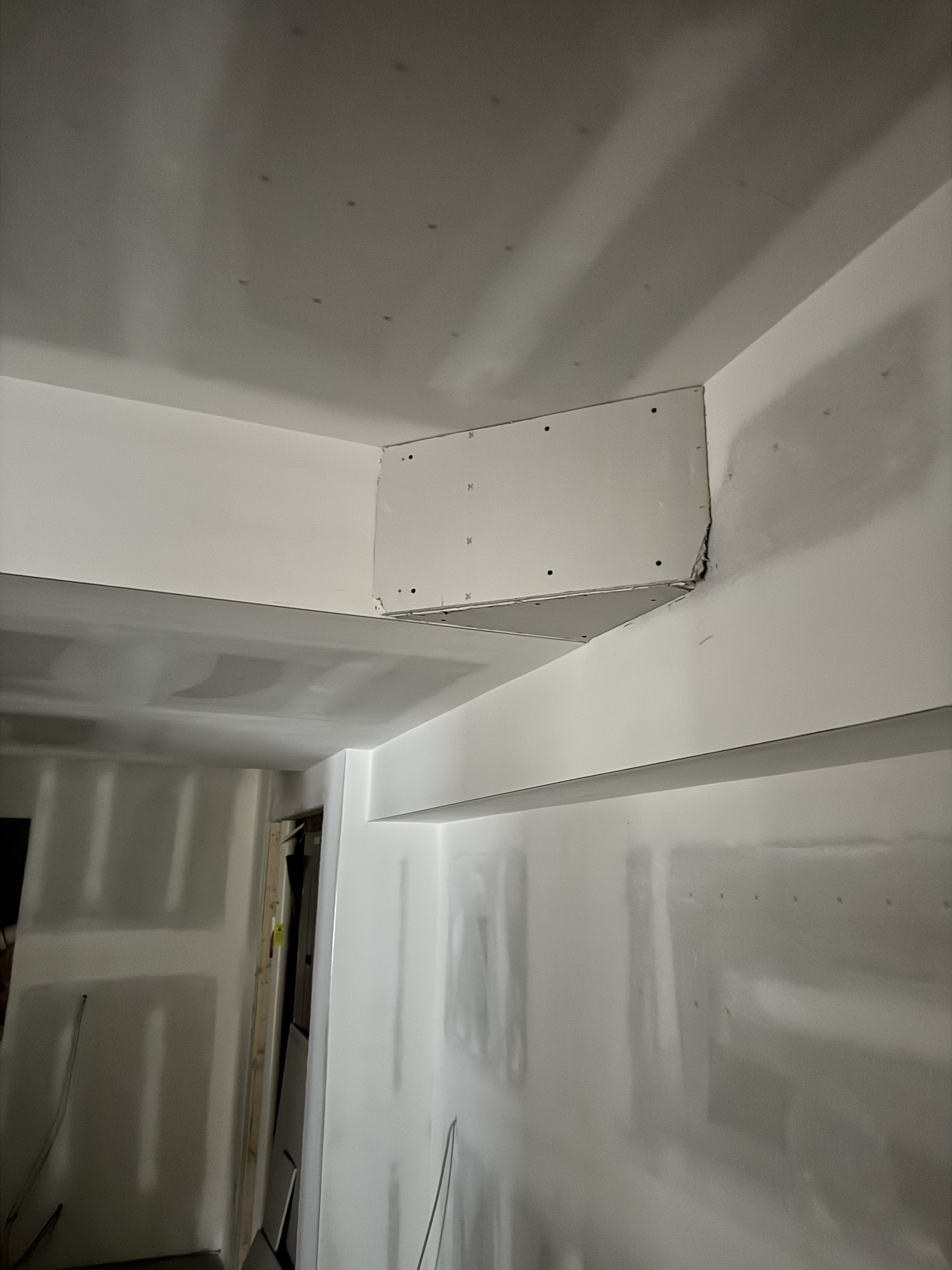 Drywall finishing progress in Apex basement renovation