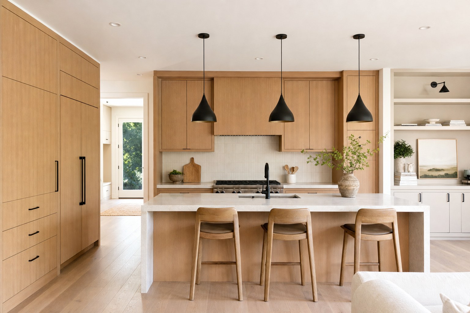 Finished kitchen with oak cabinetry and stone island