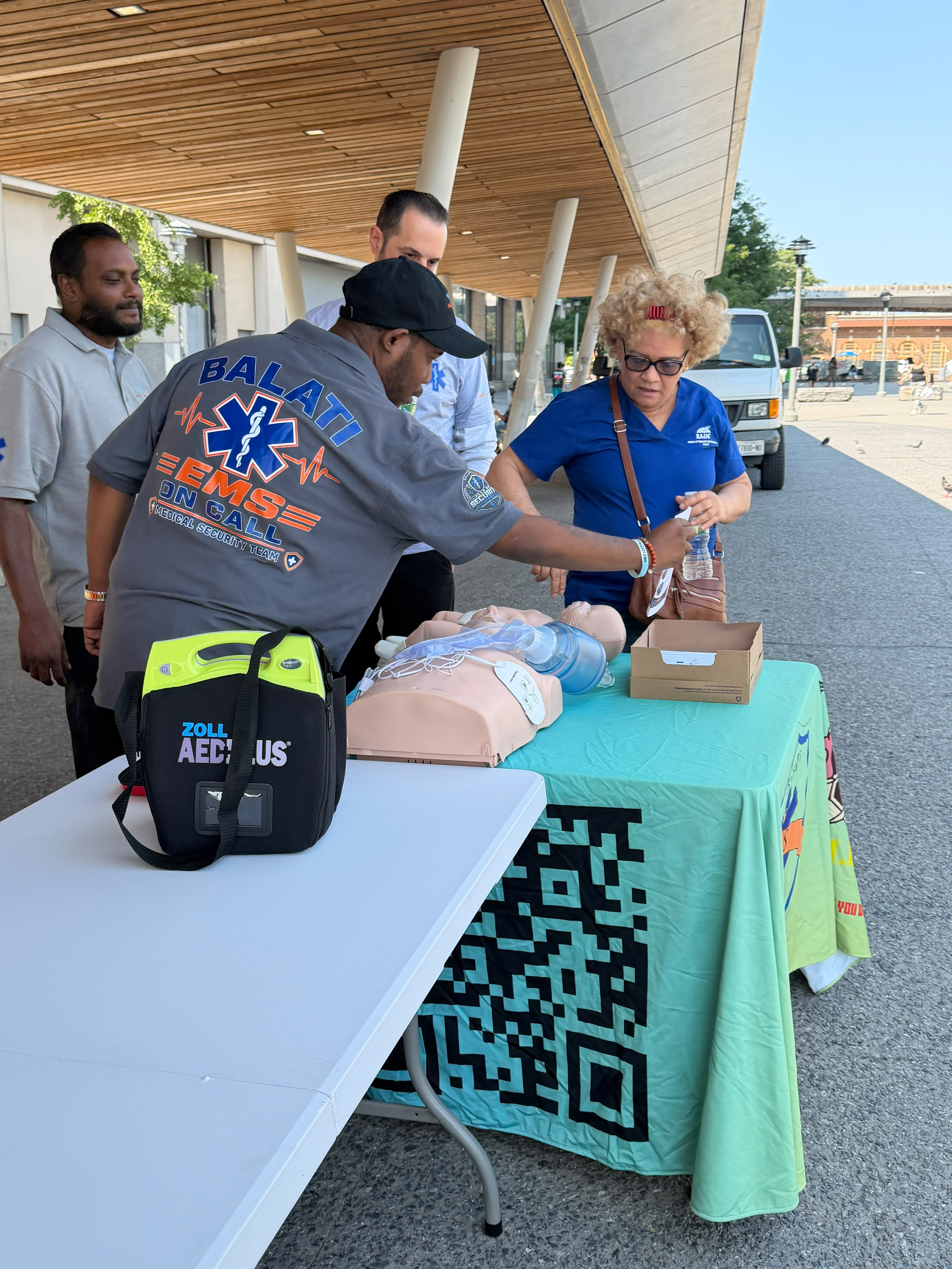 EMS team preparing medical equipment at an outdoor community event
