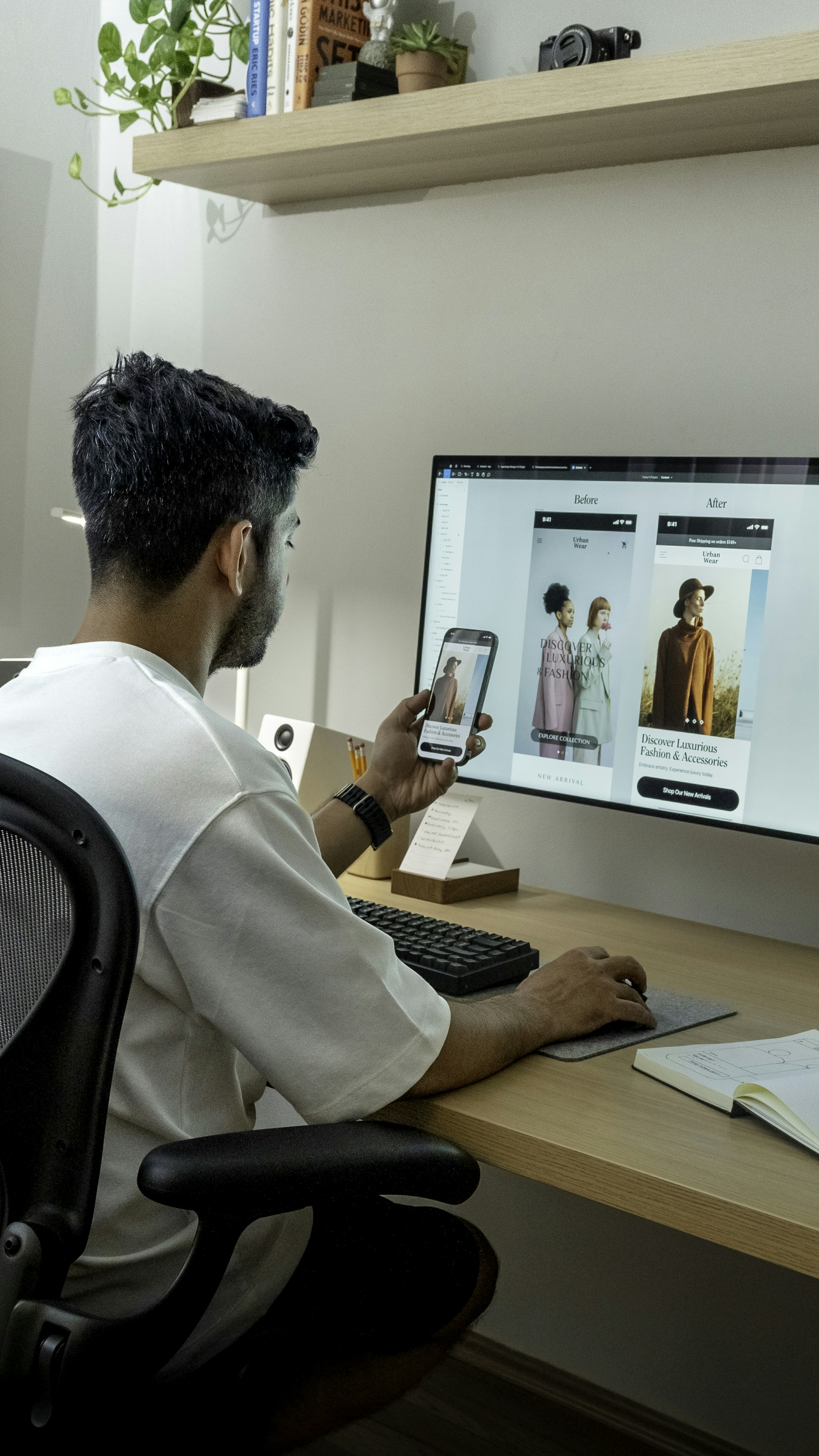 Small business owner reviewing website plans beside a laptop