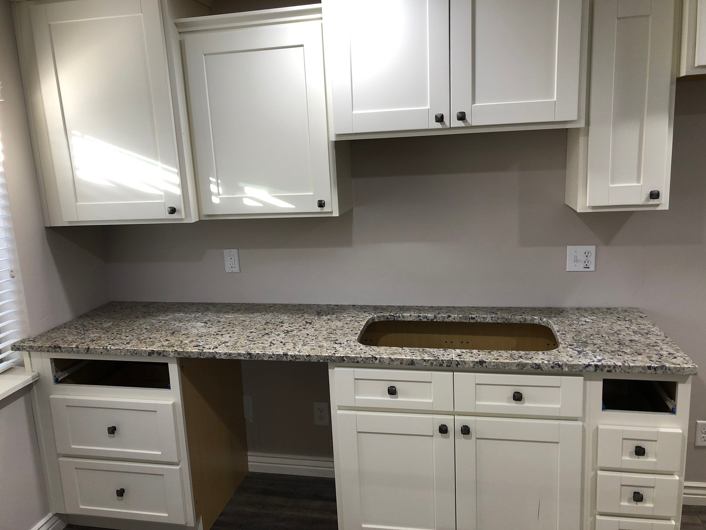 Completed white cabinet installation