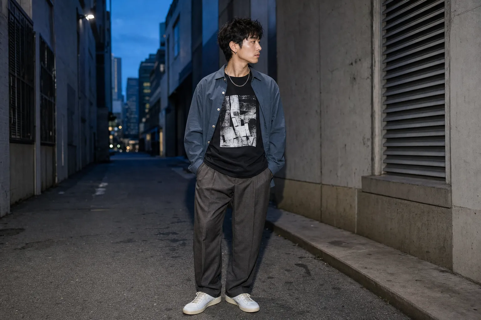 Graphic tee layered under an open overshirt