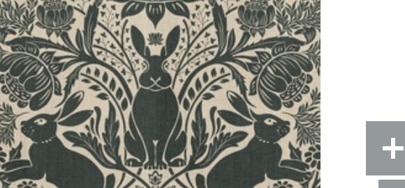 Dark green rabbit damask fabric on a warm cream ground
