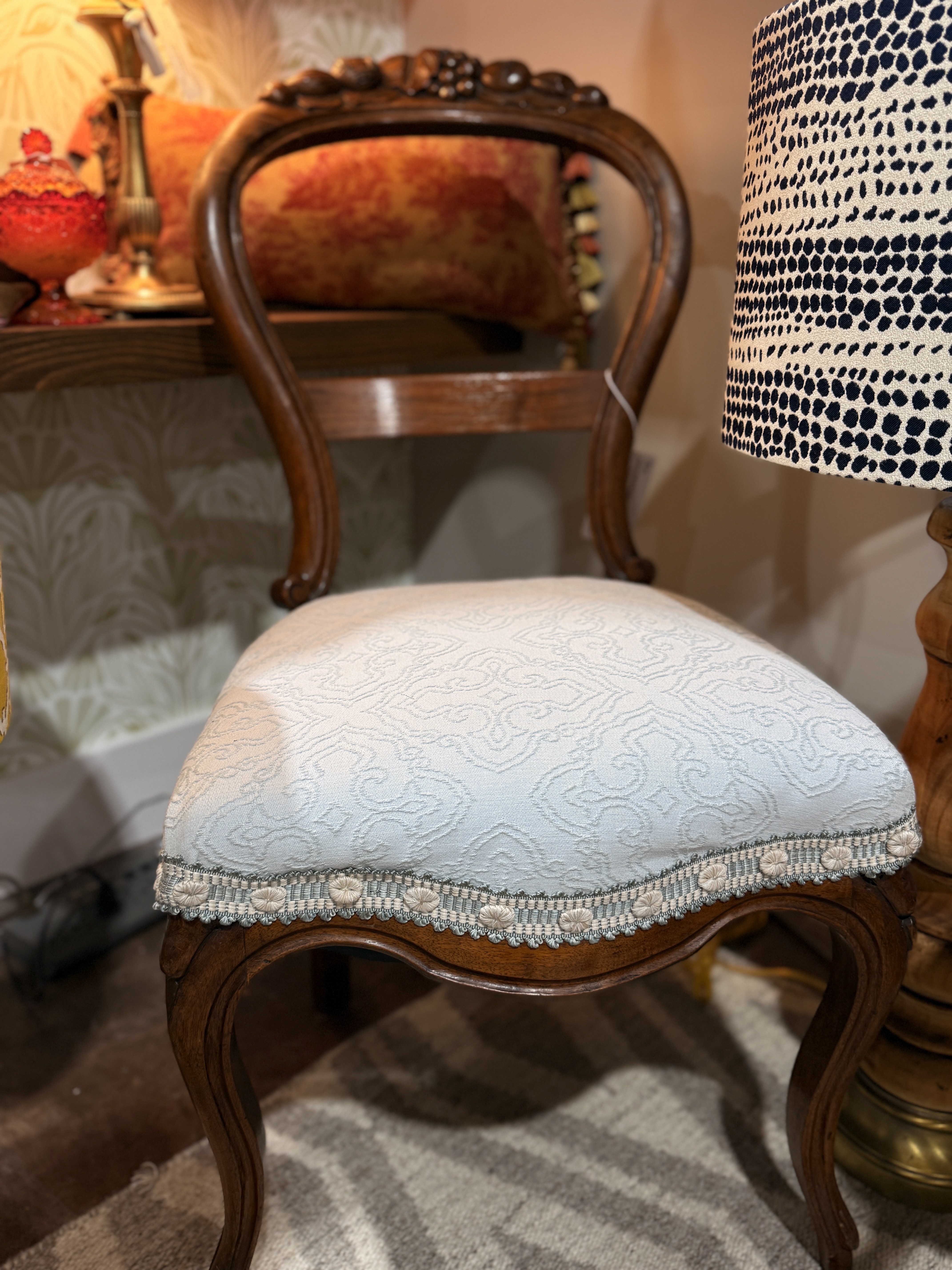 Vintage chair with a newly upholstered patterned seat