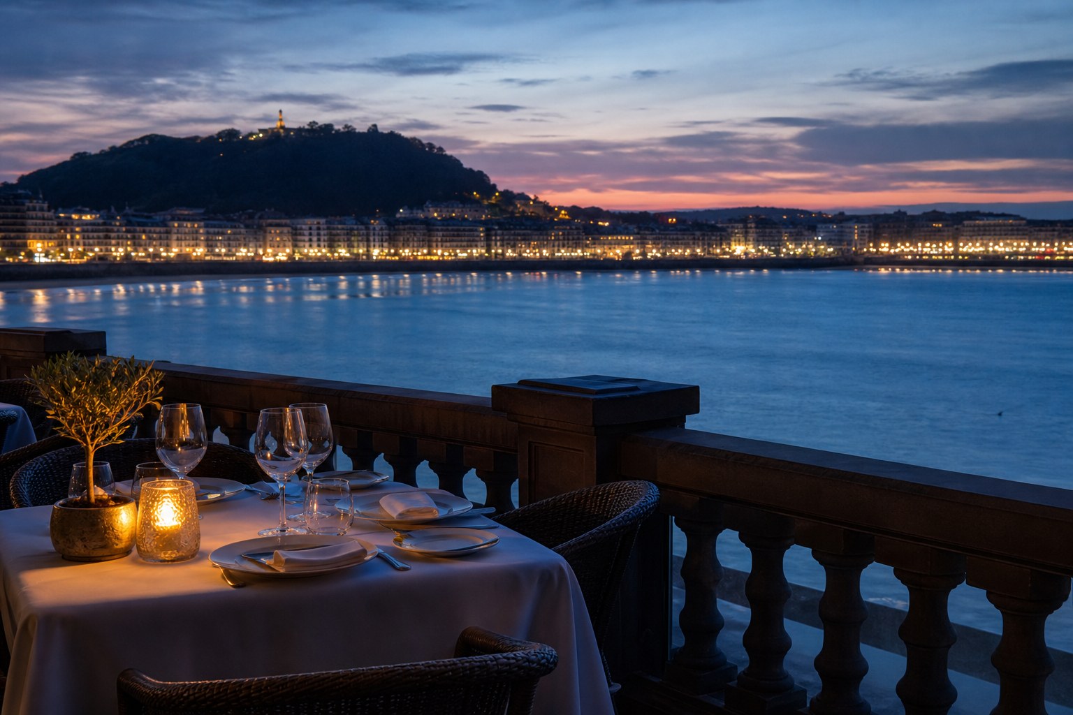 Dinner terrace overlooking San Sebastián at blue hour